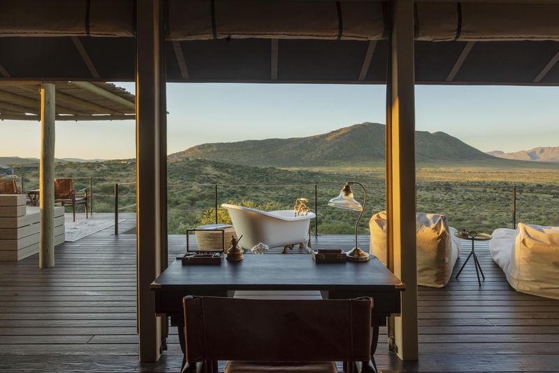 A guest suite with an outdoor bathtub that overlooks the wilderness in one of Namibia's luxury lodges