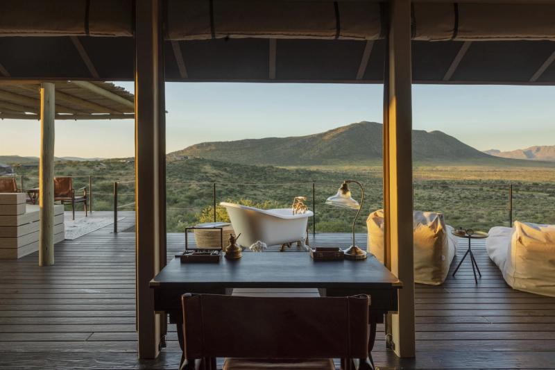 A guest suite with an outdoor bathtub that overlooks the wilderness in one of Namibia's luxury lodges