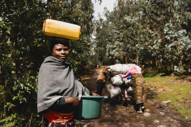 Citizens carry goods through the forests in Rwanda