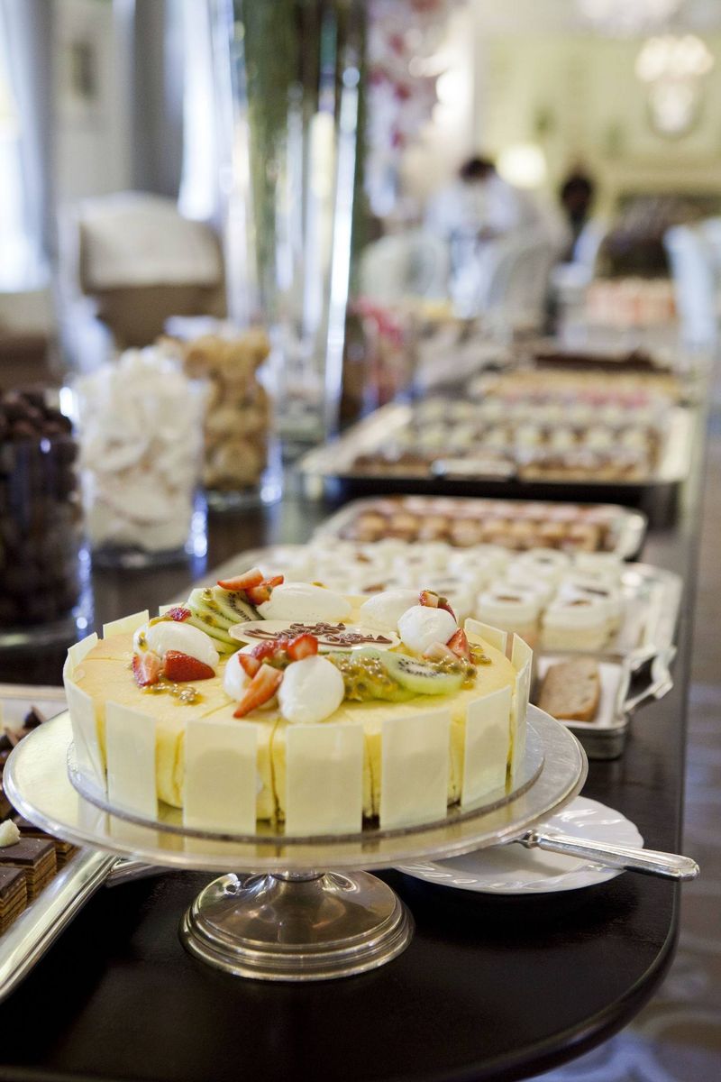 A table set out with an assortment of cakes and treats at Mount Nelson