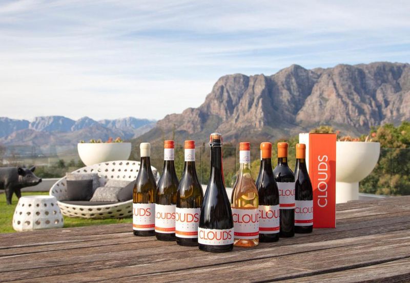 Relax in luxury and enjoy panoramic views of the Banghoek Valley, mountains, and vineyards. Image Credit: Clouds Estate