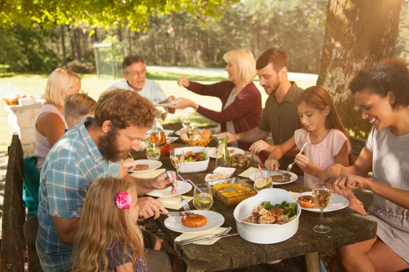 A family enjoying a meal of typical South African food