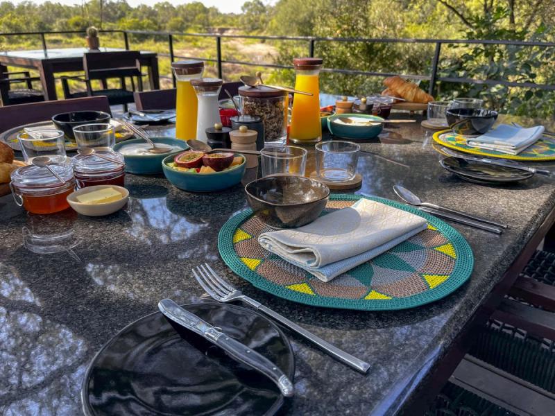 The Jackalberry tree-shrouded lower breakfast deck at Silvan Safari Lodge