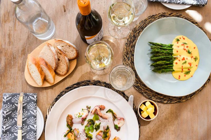 An assortment of plates and wine at The Vine Bistro