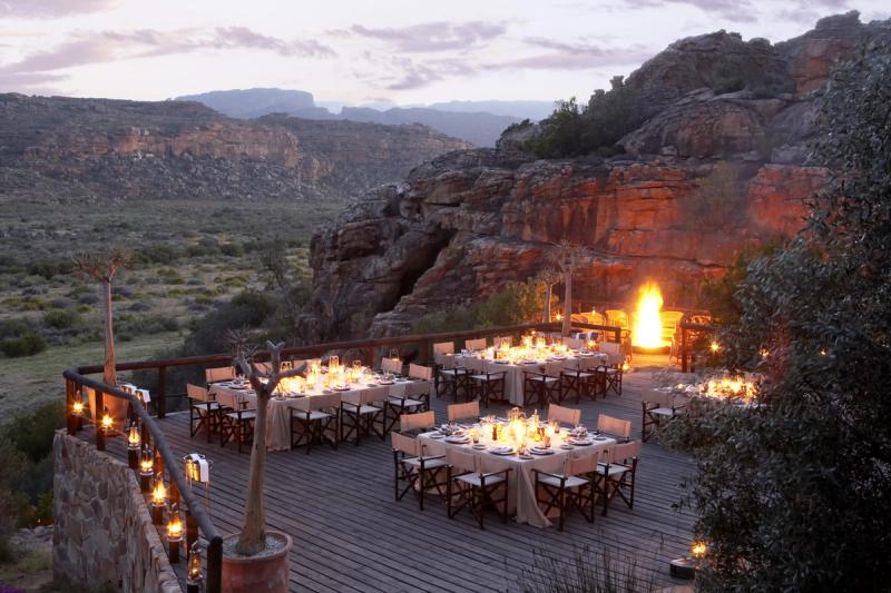 An outdoor dining deck at Bushmans Kloof i
