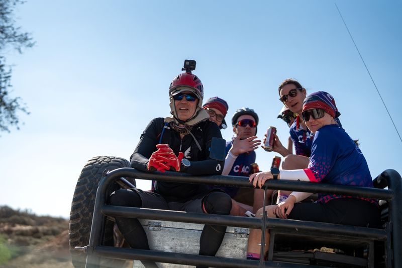 Rescued riders on the back of the 4x4 vehicle