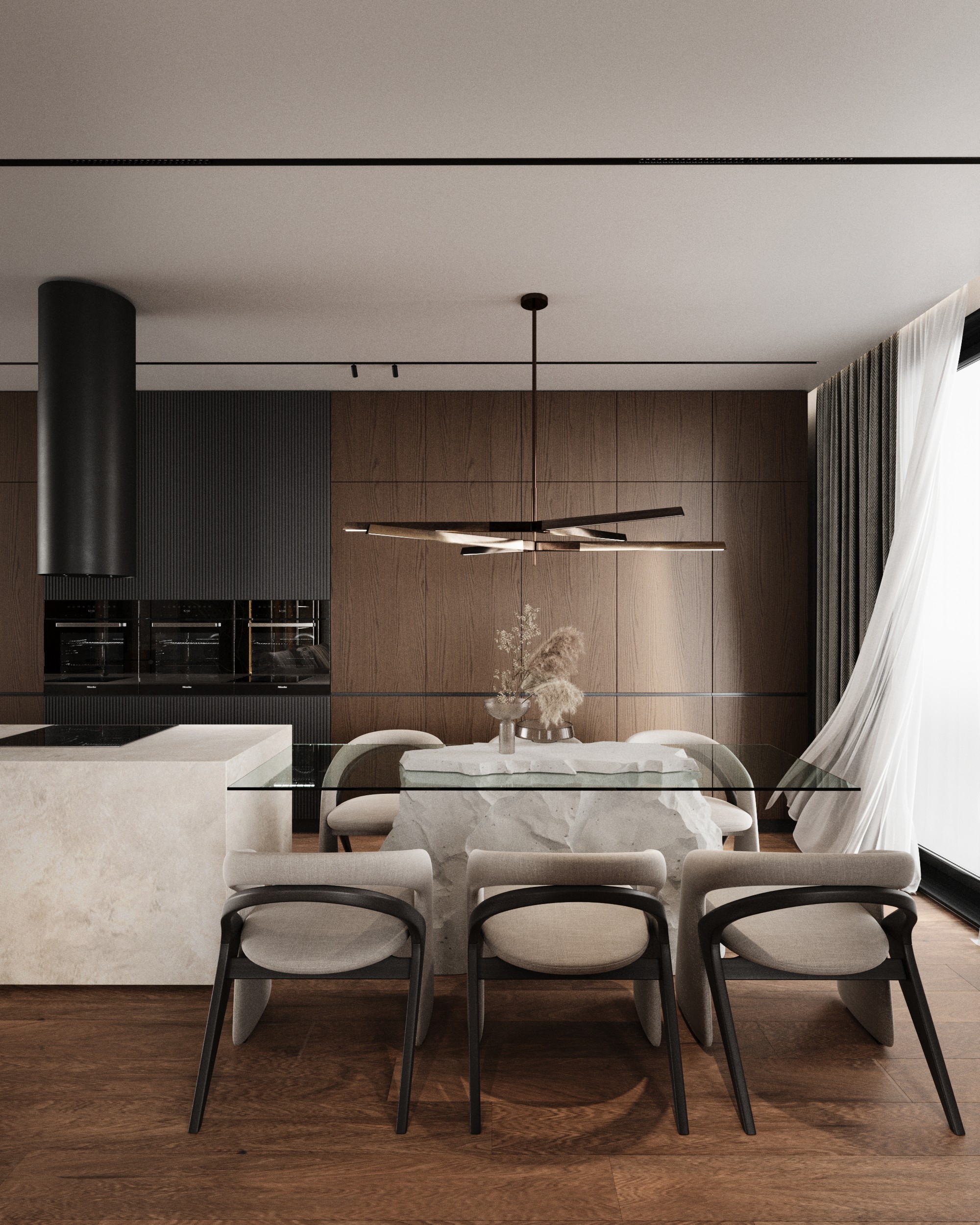 Dining table with curved black chairs and the kitchen behind, Shega19 house in Tetovo