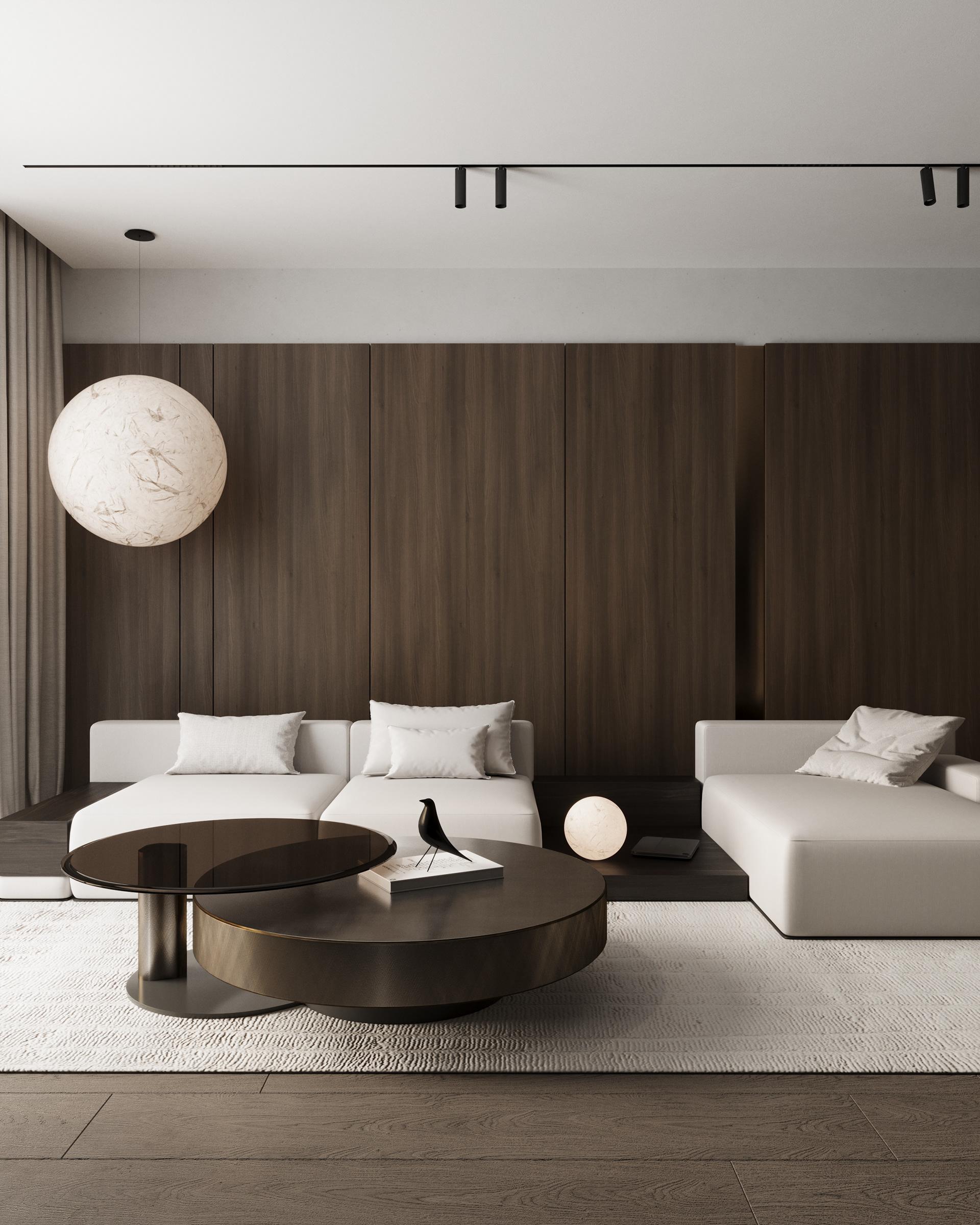 Living room with dark wood wall, white sofa and round coffee tables, apartment in Skopje