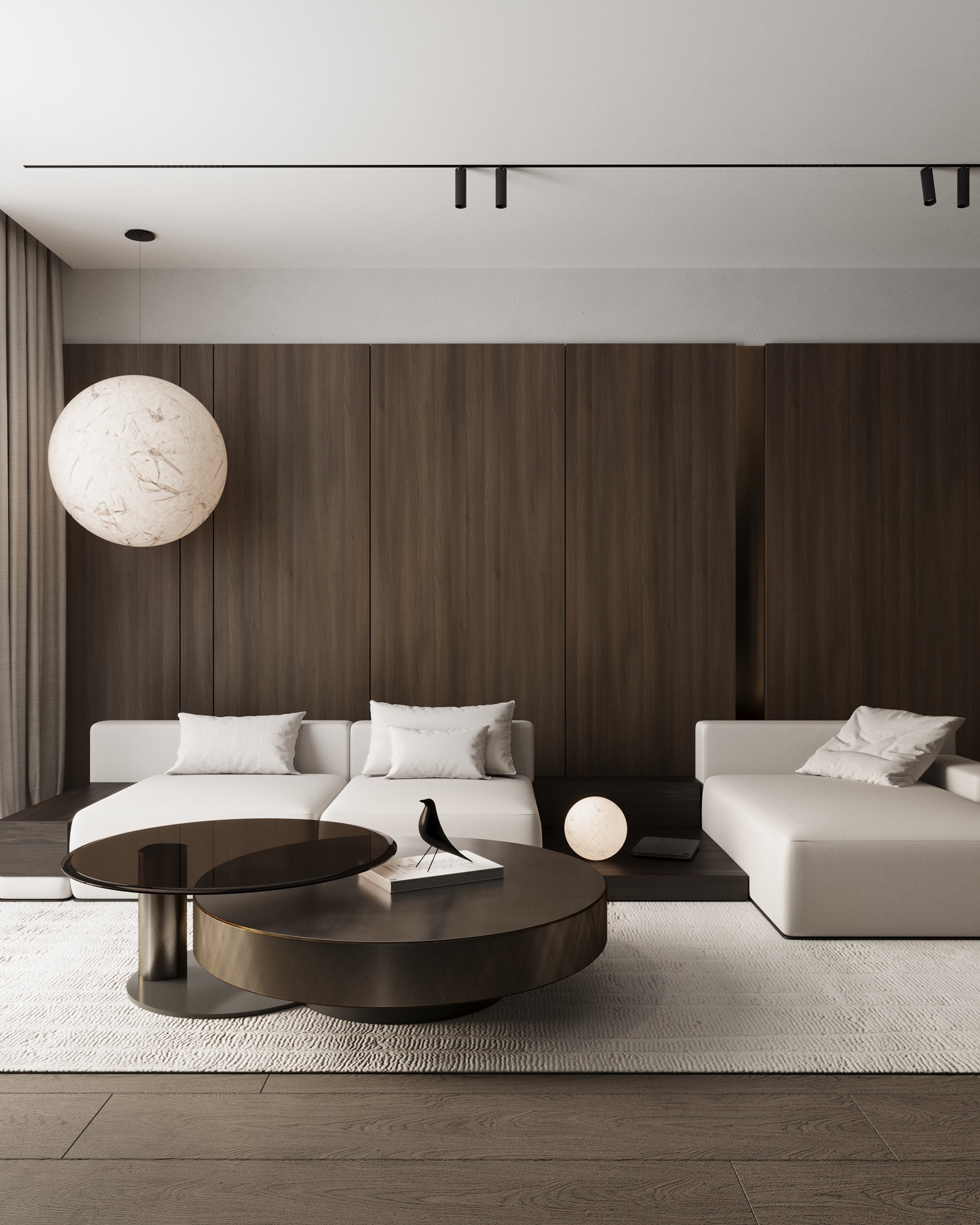 Living room with dark wood wall, white sofa and round coffee tables, apartment in Skopje