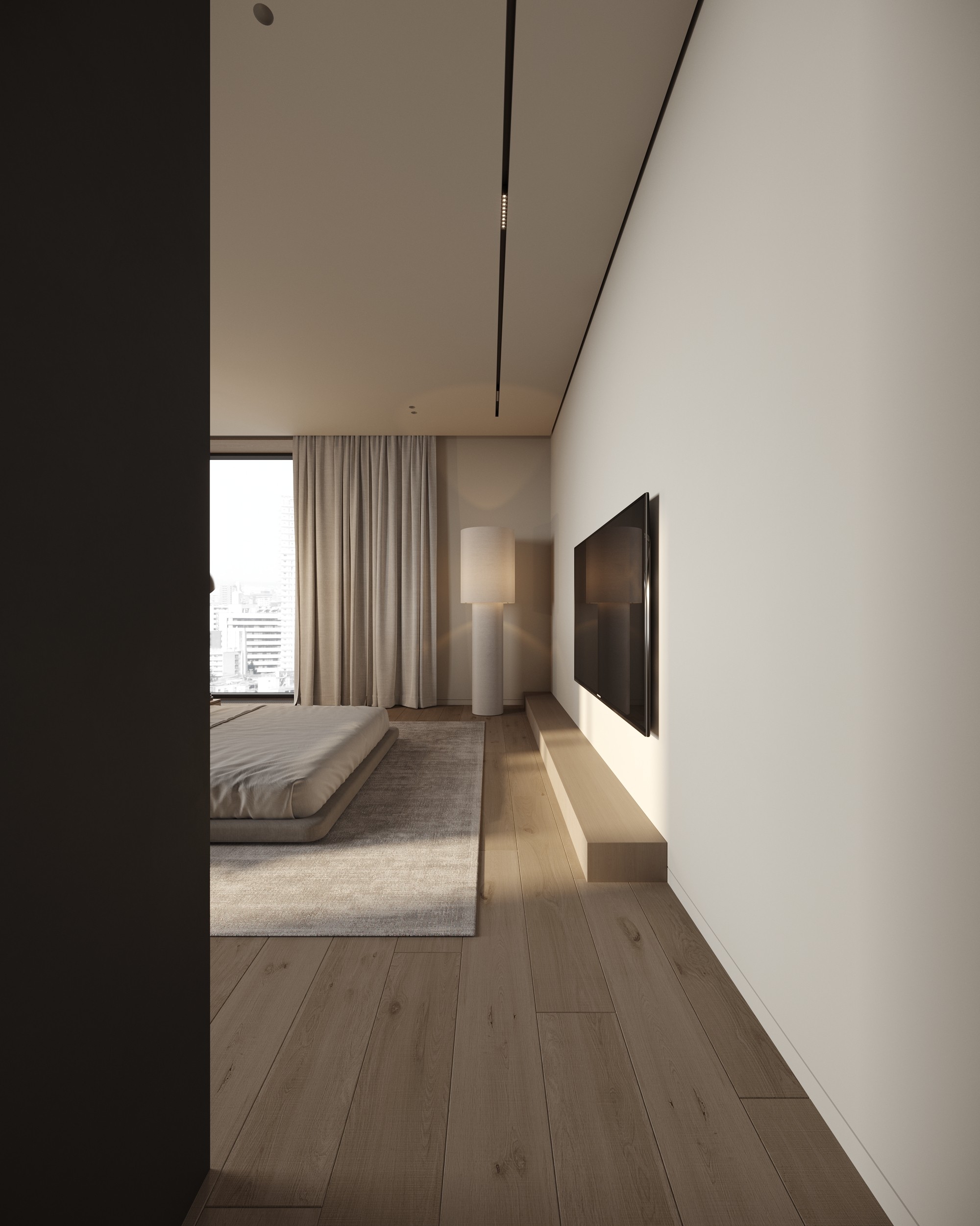 Bedroom with wall-mounted TV seen through the doorway, apartment GV75 in Gostivar