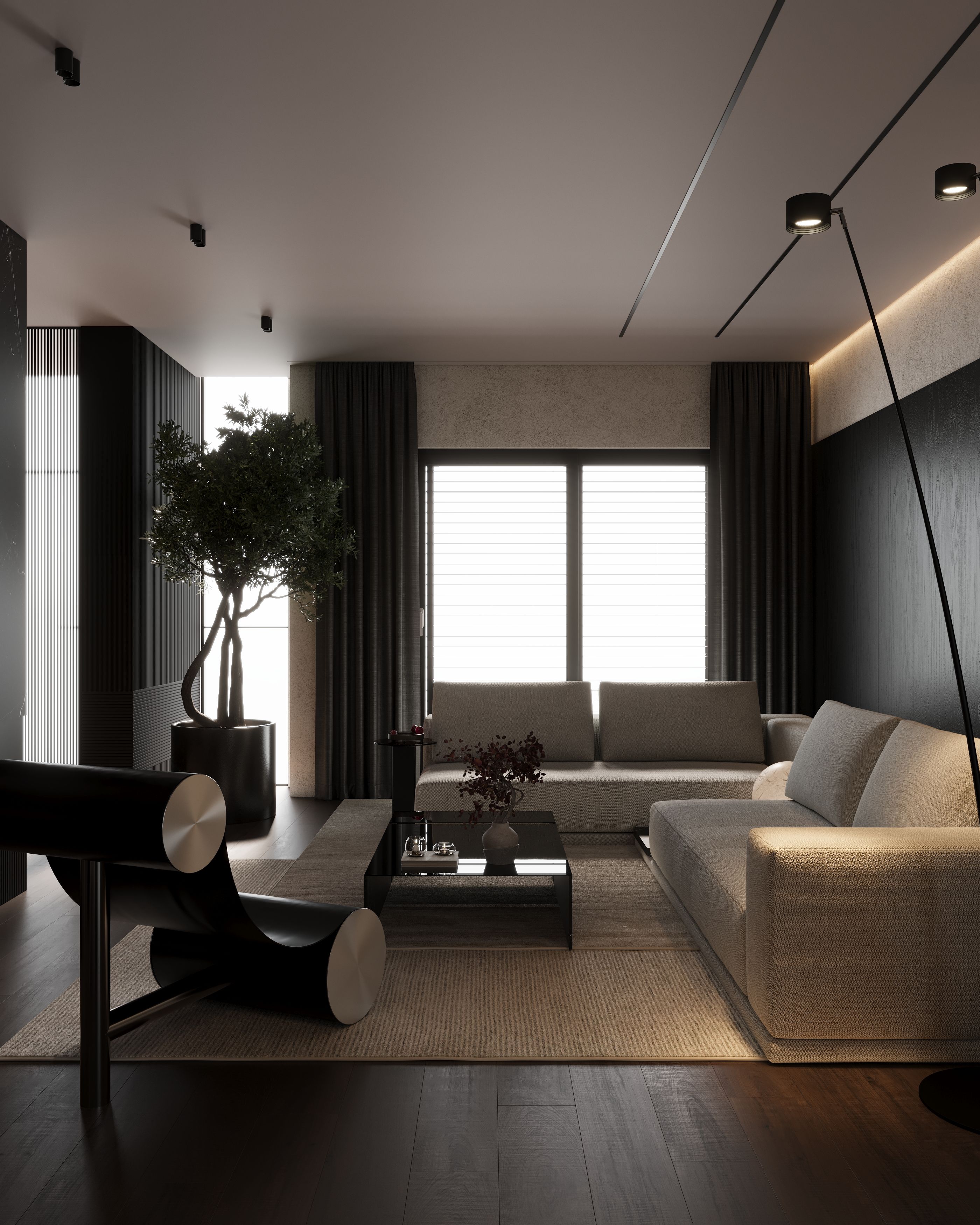 Living room with black armchair, olive tree and beige sofas, Dark One apartment in Tetovo