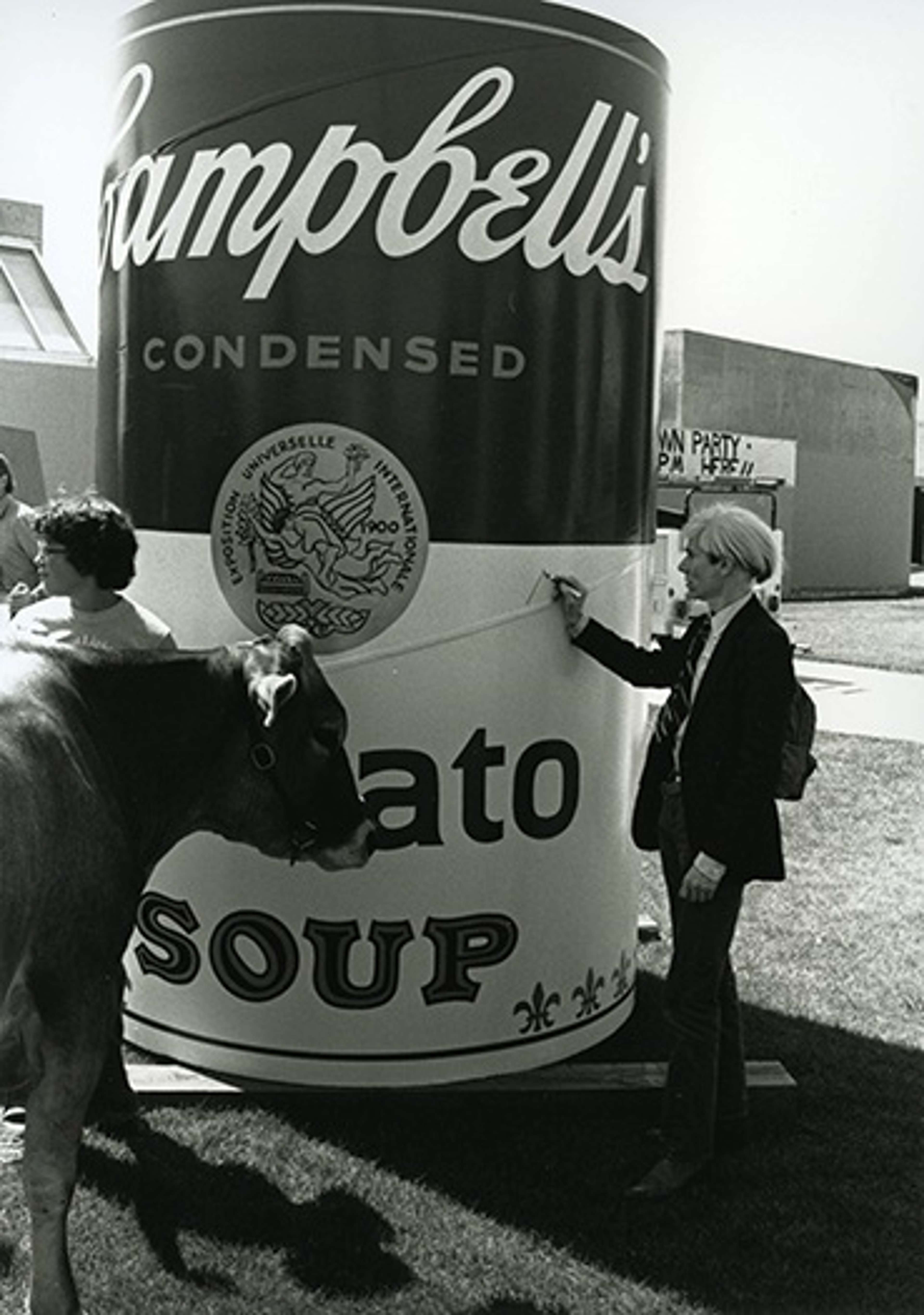 Andy Warhol signing oversized soup cans during his visit to Colorado State University in September 1981 - MyArtBroker