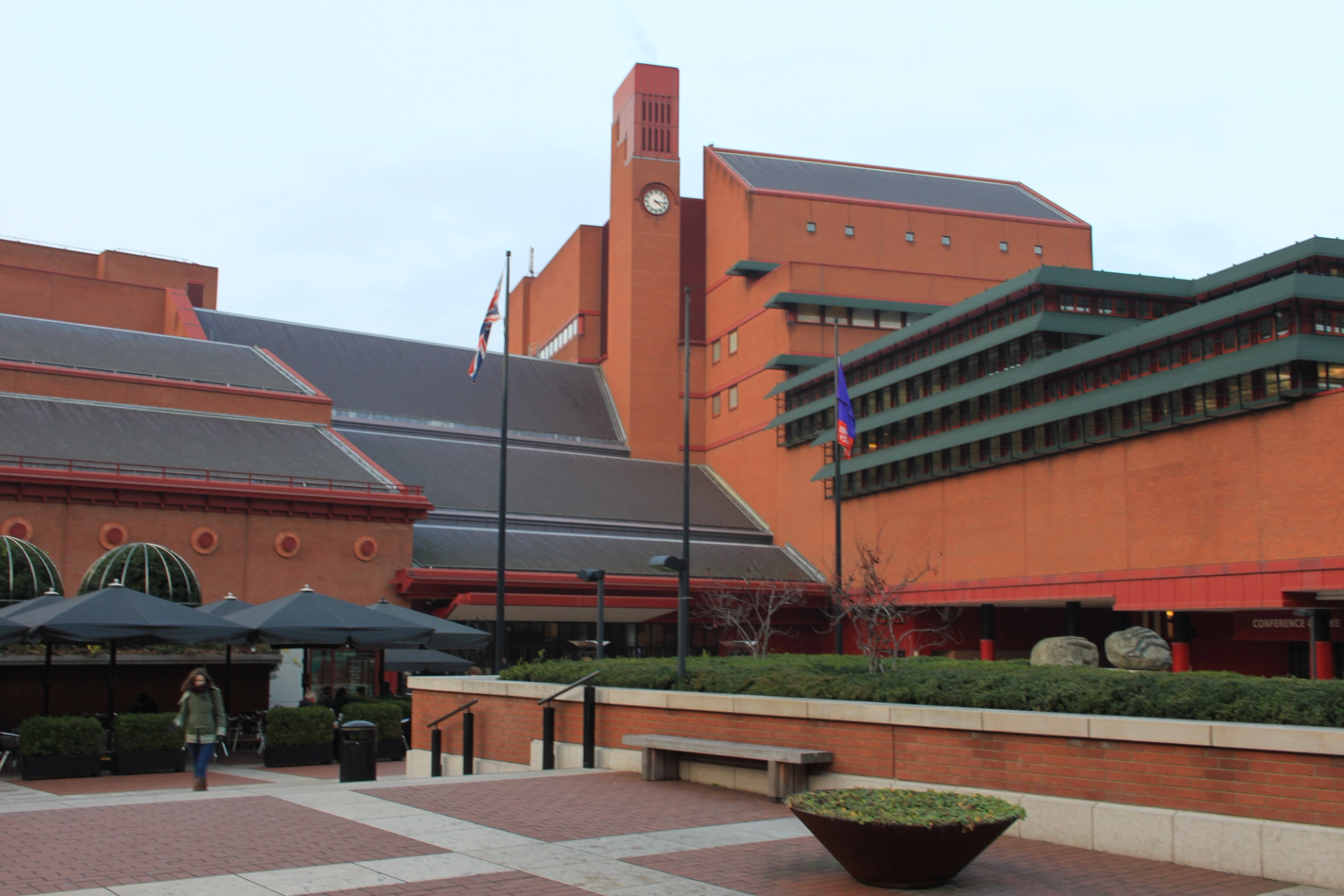 An image of the outside of the British Library in London, showing a large, geometric red brick building.