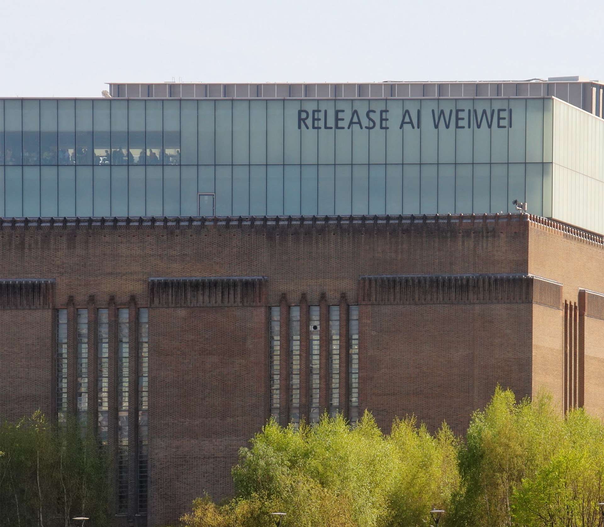 An image of Tate Modern, with an inscription saying “Release Ai Weiwei”