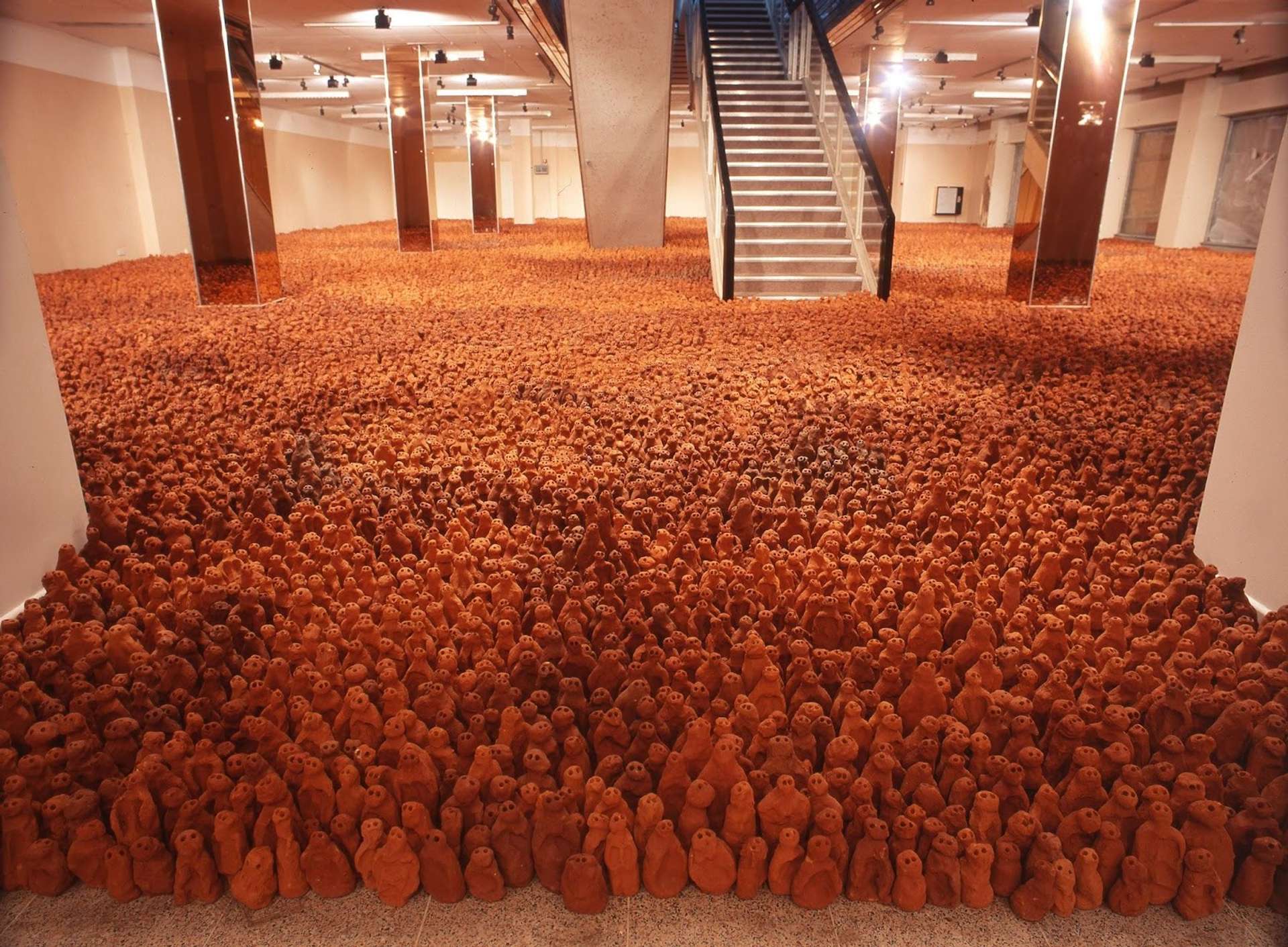 Antony Gormley's installation Fields for the British Isles: A depiction of over 40,000 uniquely shaped terracotta figures arranged in a field.