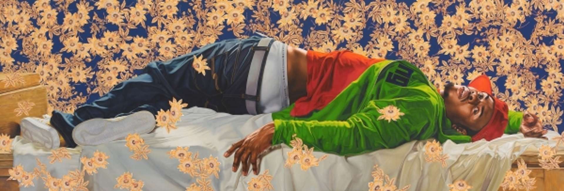 Kehinde Wiley’s Femme Piquée Par Un Serpent. A man laying down in a bed surrounded by flowers dressed in streetwear.