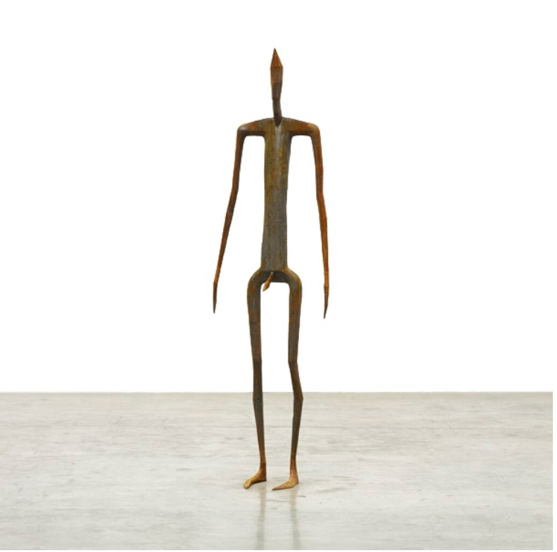 An outline cast iron sculpture of a standing human figure.