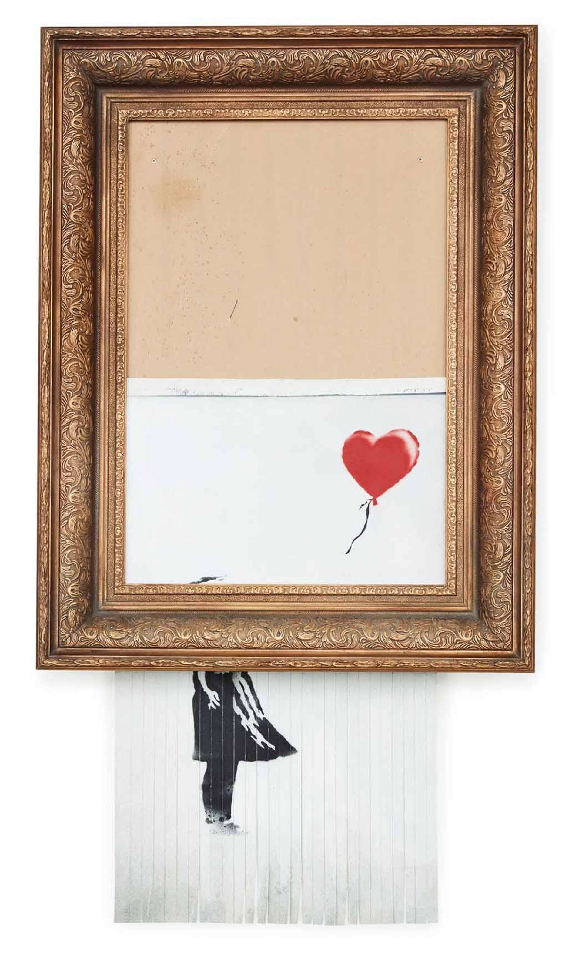 An image of Banksy's shredded Girl With Balloon painting, suspended from a gold gilt frame