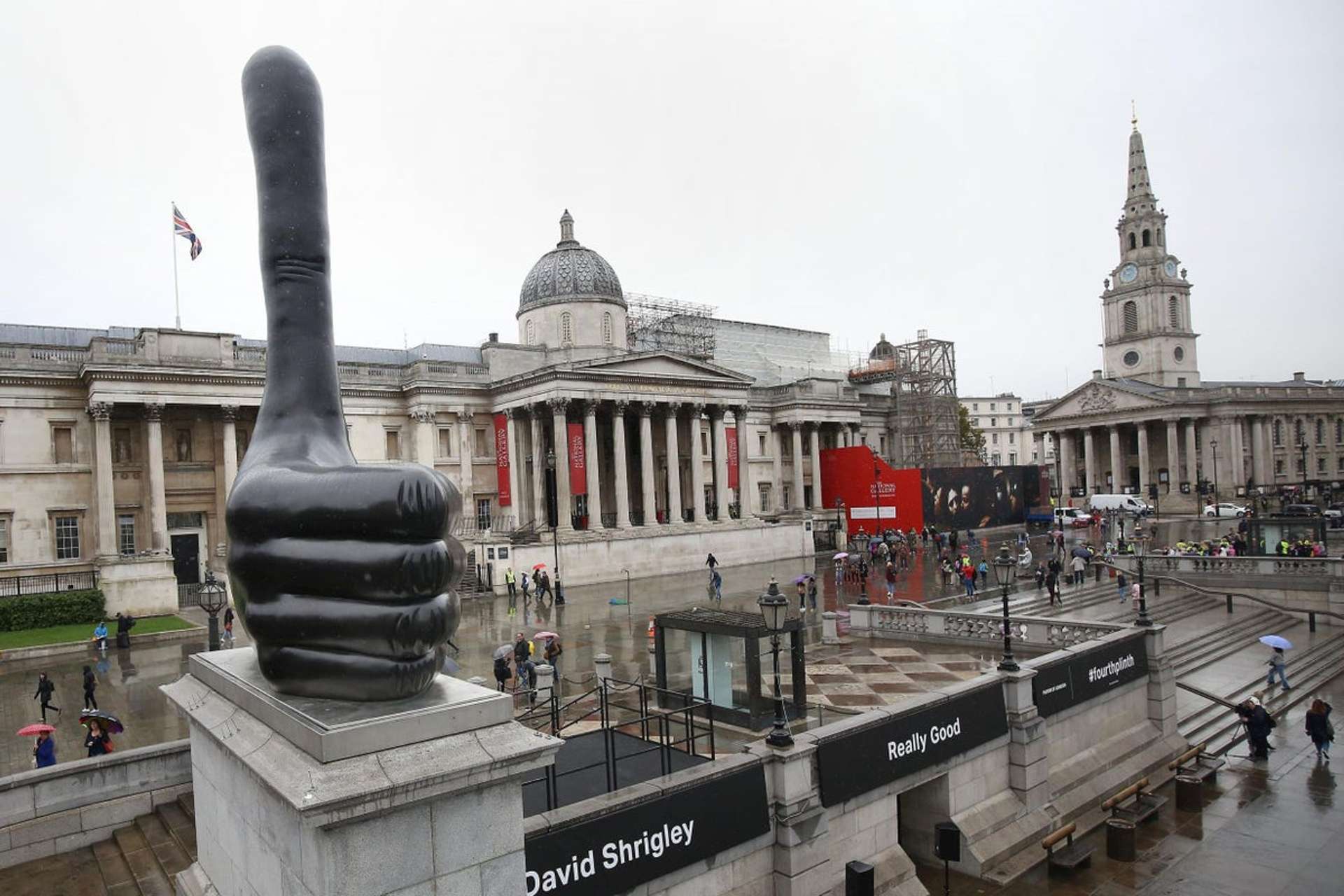 An image of the giant sculpture Really Good by artist David Shrigley, a massive thumbs-up displayed on Trafalgar’s Square Fourth Plinth. The National Gallery, London is in the background.An image of the giant sculpture Really Good by artist David Shrigley, a massive thumbs-up displayed on Trafalgar’s Square Fourth Plinth. The National Gallery, London is in the background.