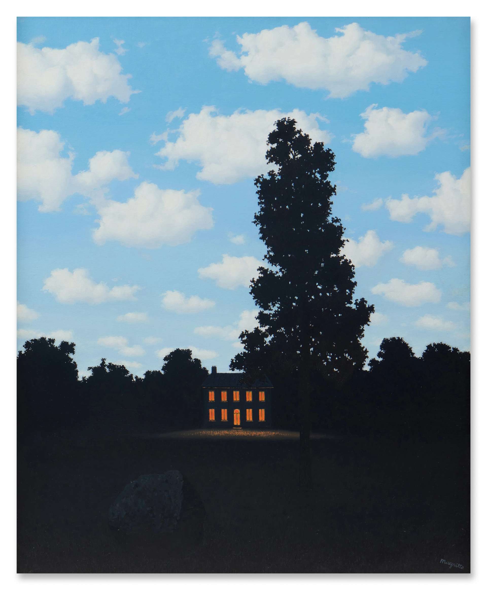 A painting of a large house by René Magritte positioned in the distance of a vast field, framed by towering trees. The field is depicted in dark shades while the sky is painted in light blue tones with white clouds. The house’s windows emit an orange glow creating a nighttime ambiance. 