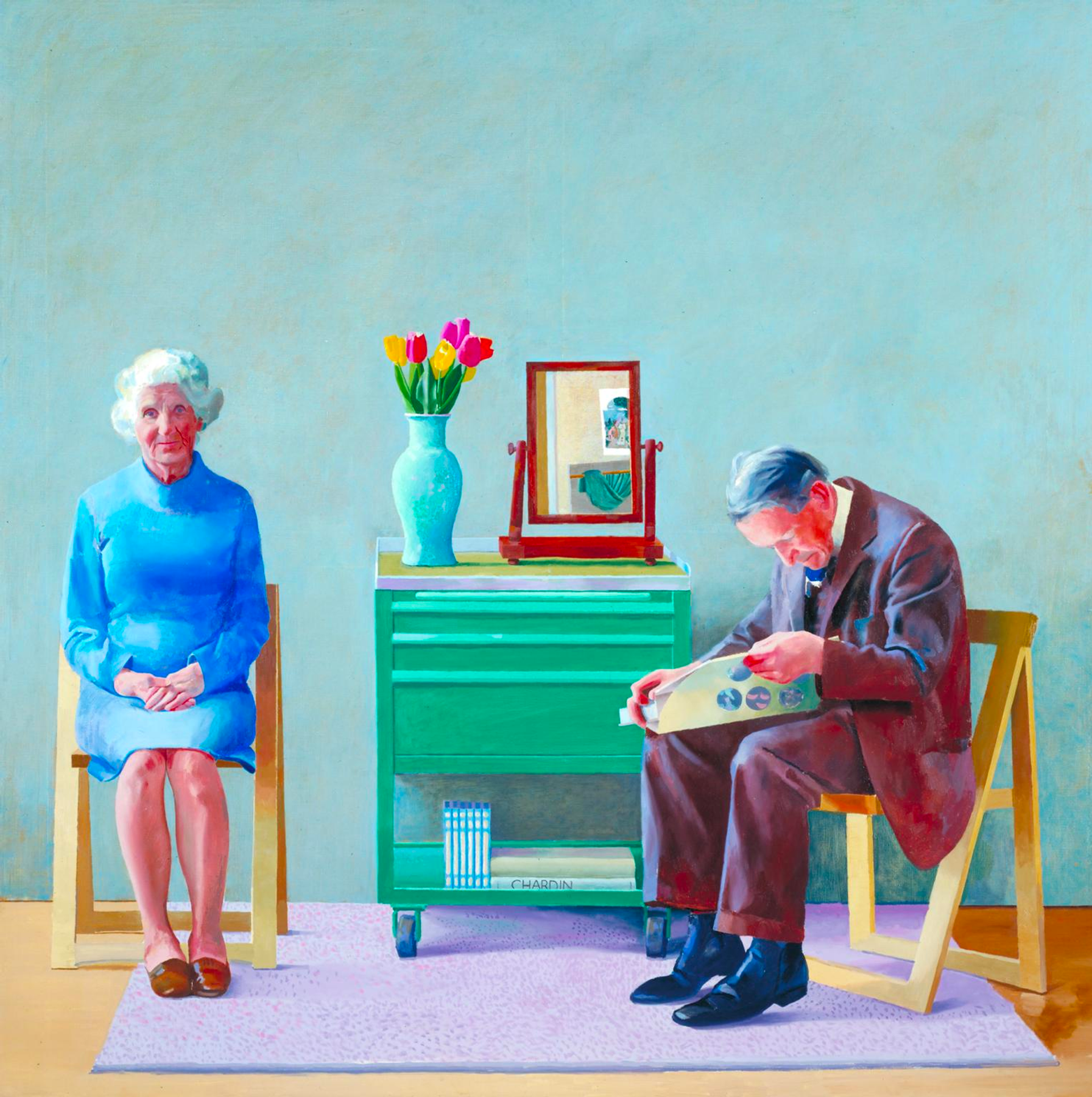 A woman in a blue dress sits facing the painter; a man in a brown suit suits adjacent to her, reading a book. A green furniture unit is inbetween the subjects, flowers in a vase and a mirror sit on top of it.