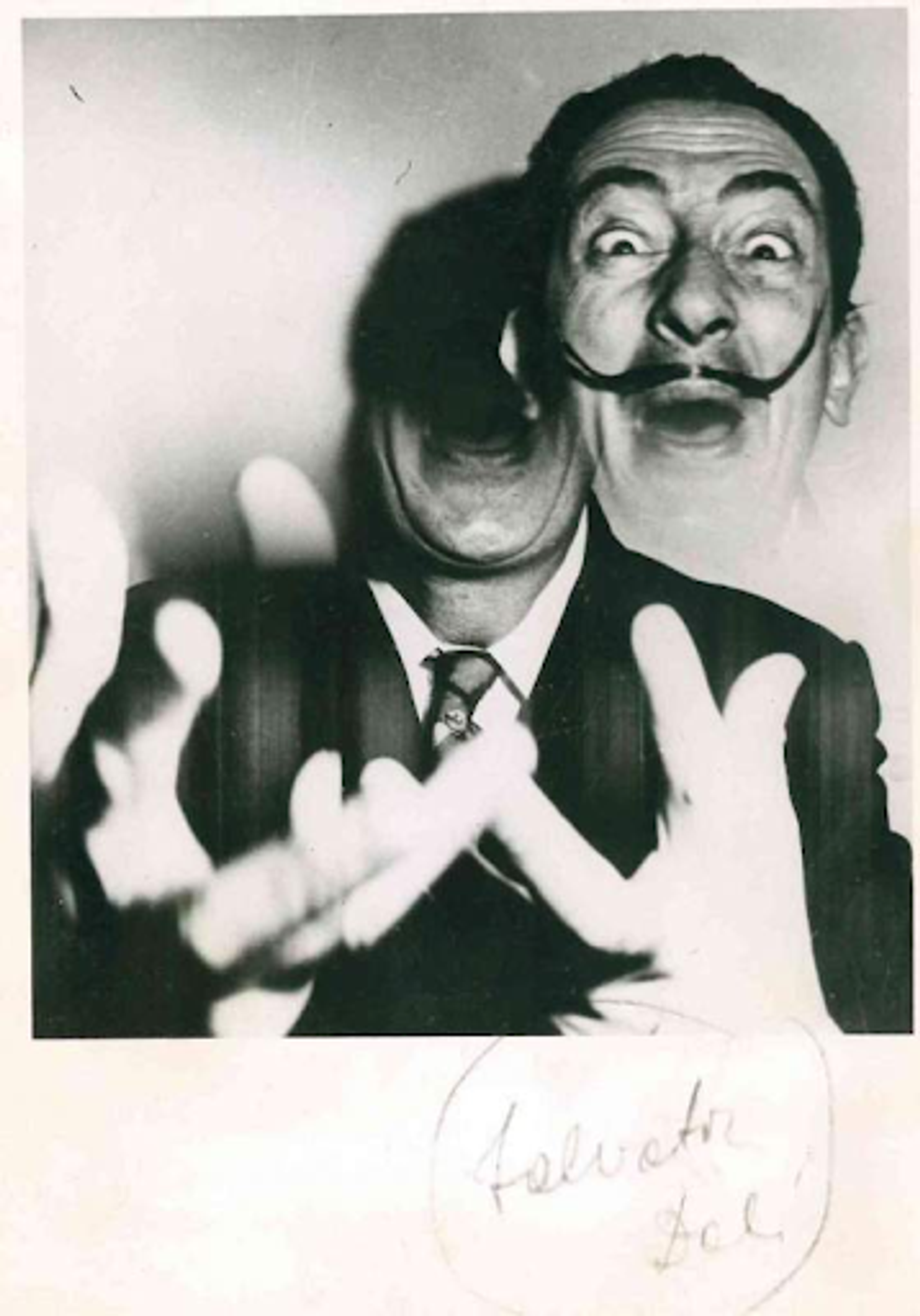 A black and white polaroid photograph; a distorted image of Salvador Dalí.