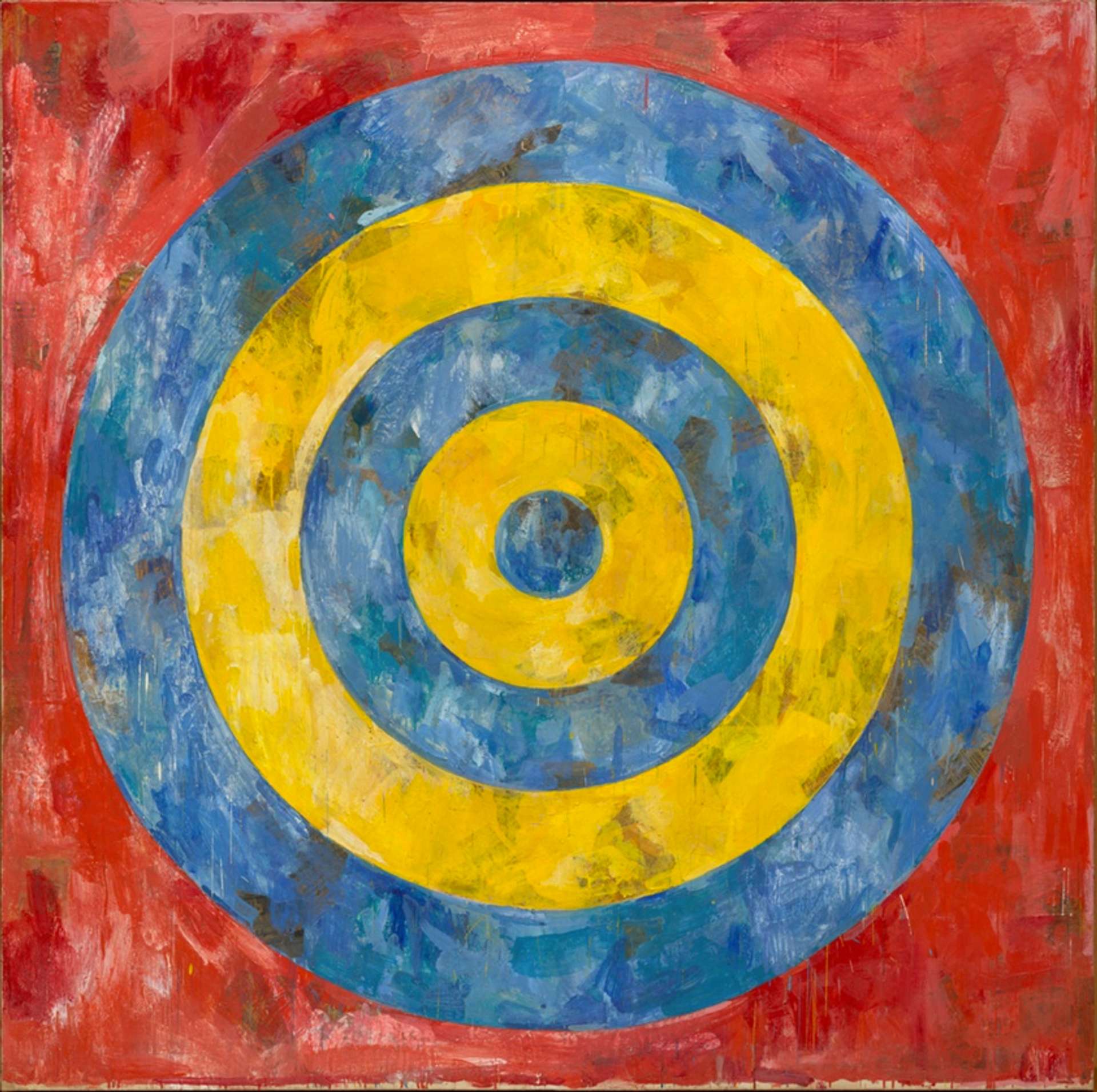 A yellow and blue target set against a red background.