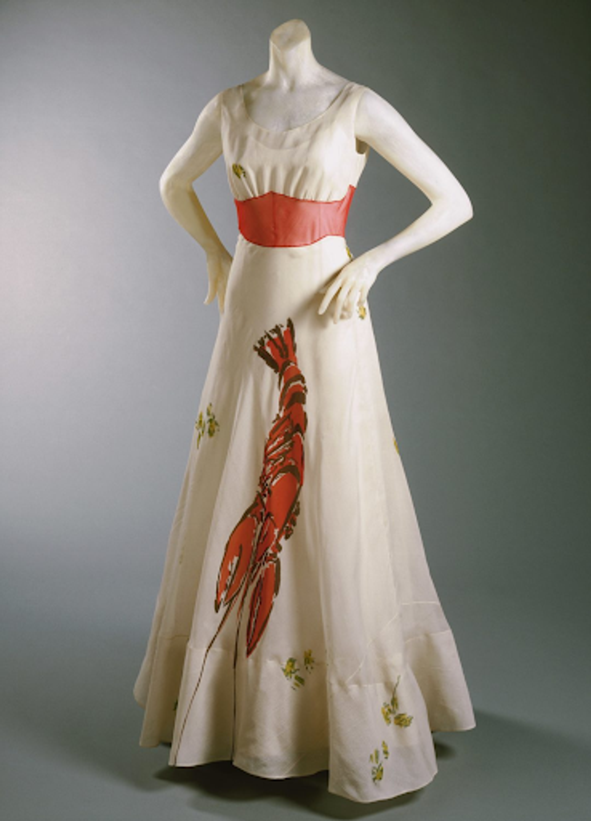 Photograph of a white, sleeveless dress with a lobster on it
