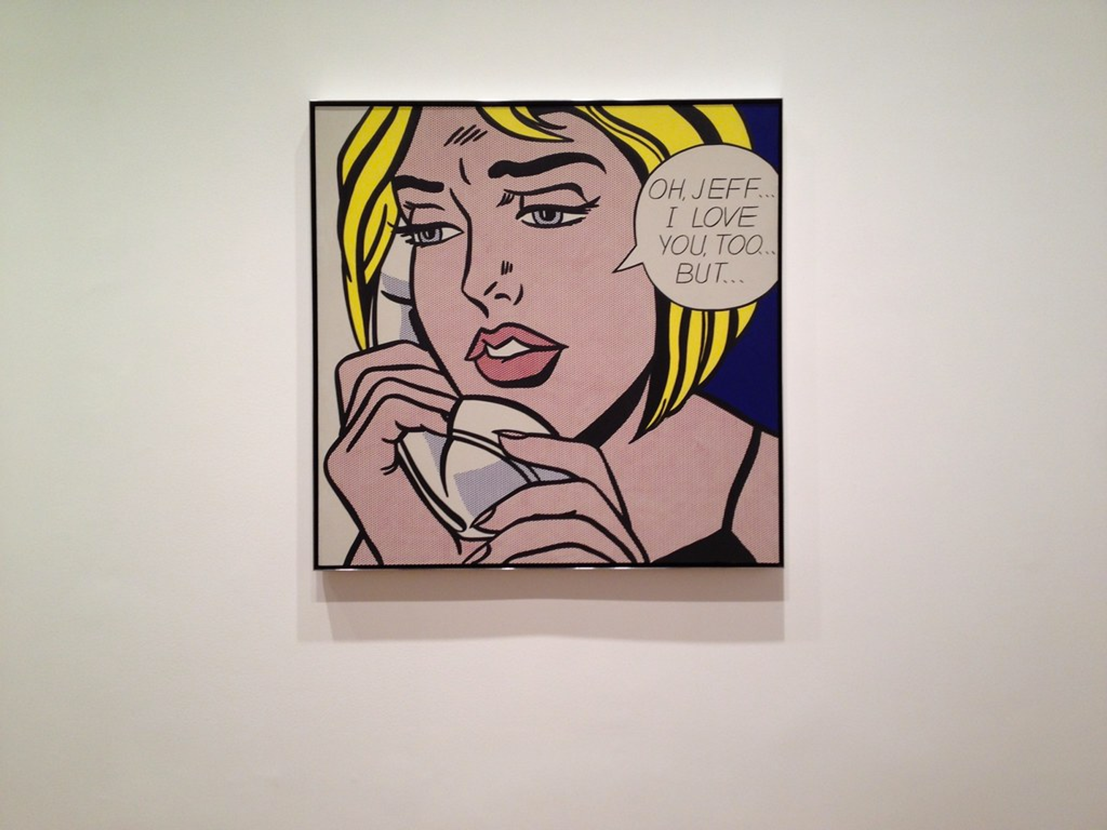 This painting shows a beautiful blue eyed, blond hair, full lips female subject while presenting sad eyes, that seem to give in to what seems to be a doomed love affair. She is talking on the phone, and professing the work's title in a speech bubble.