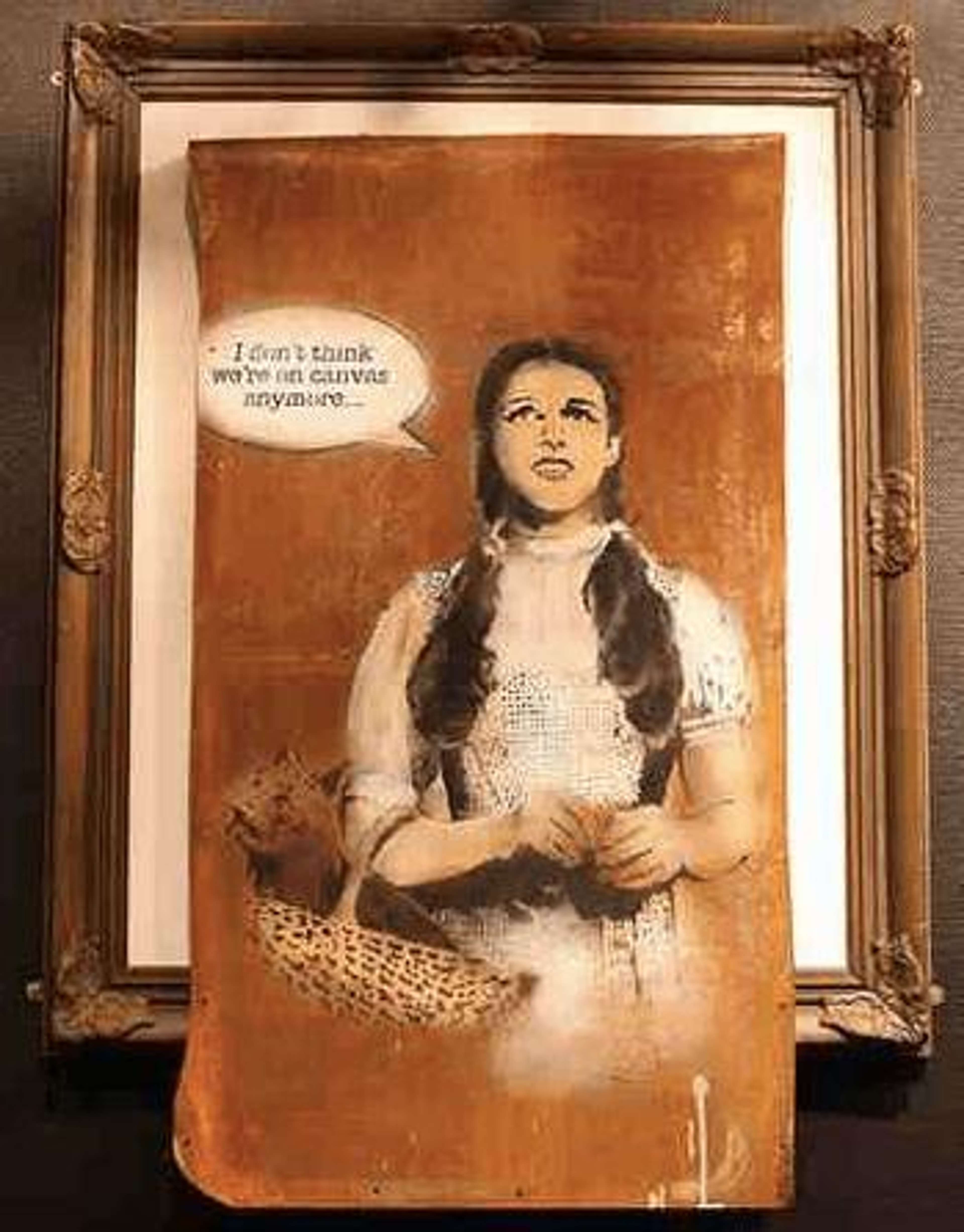 Banksy's Dorothy. A spray paint work on a poster of the character Dorothy holding a dog in a basket with the text "I don't think we're on canvass anymore..."