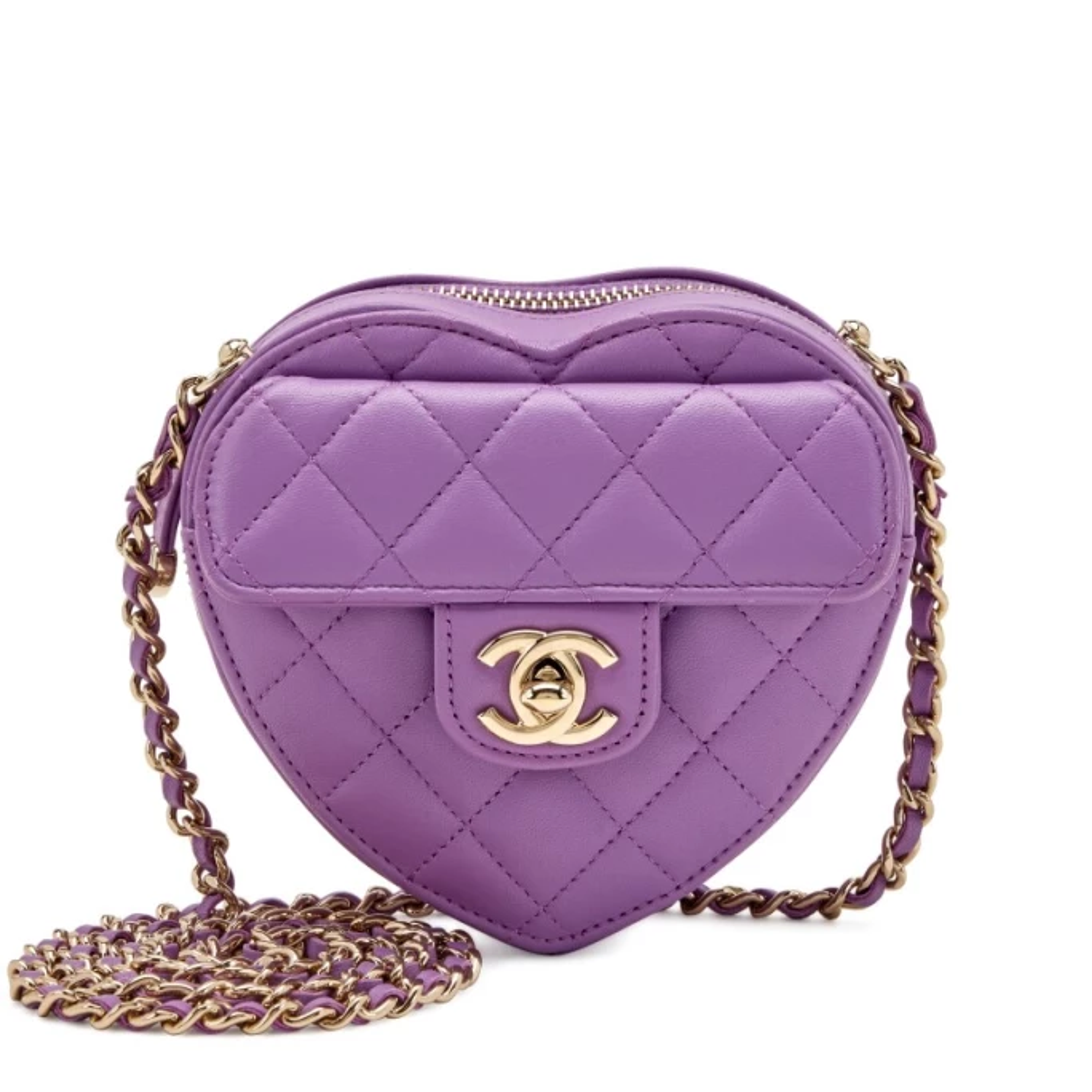 Close up of a purple, quilted heart-shaped Chanel handbag
