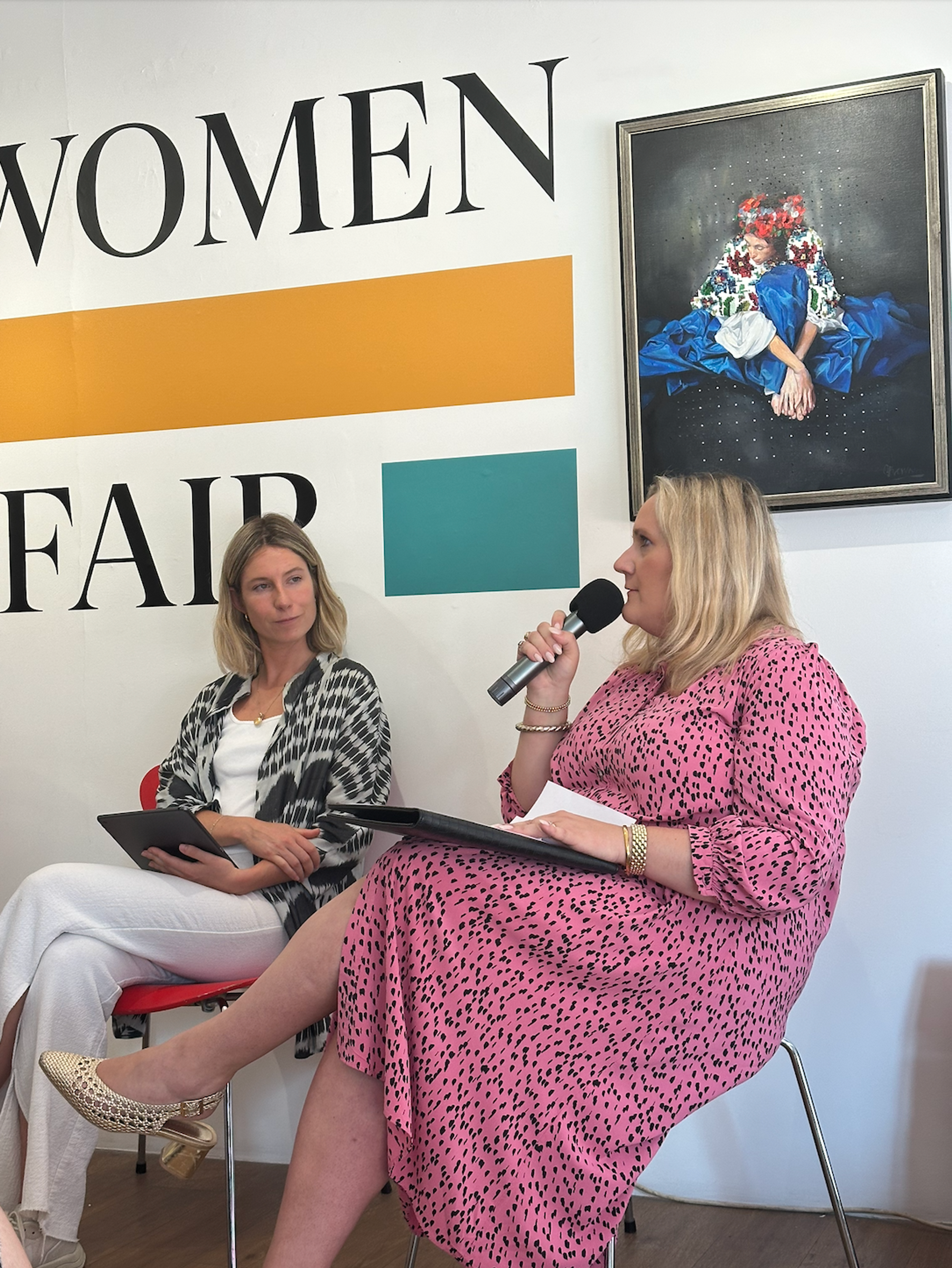 Carolin von Massenbach speaking at WIAF, next to Jess Bromovsky