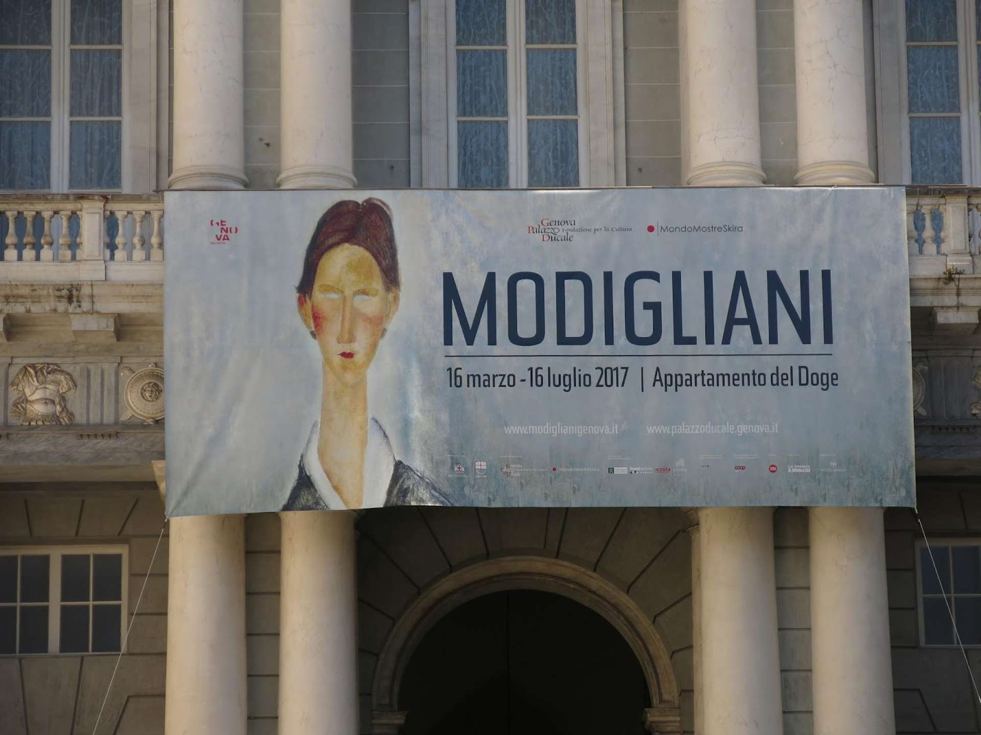 An image of the sign for the Modigliani exhibition at the Palazzo Ducale in Genoa.