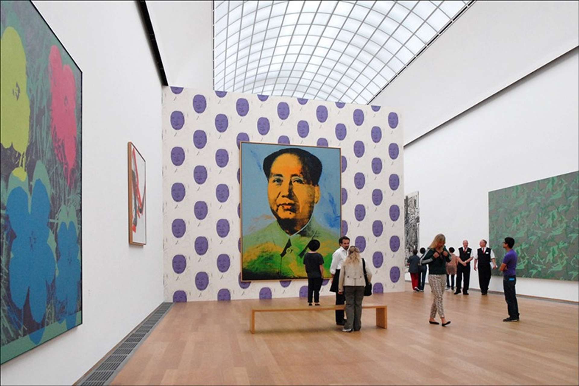 A row of Andy Warhol's Mao paintings (1972) on display at the Tate Modern in London - MyArtBroker