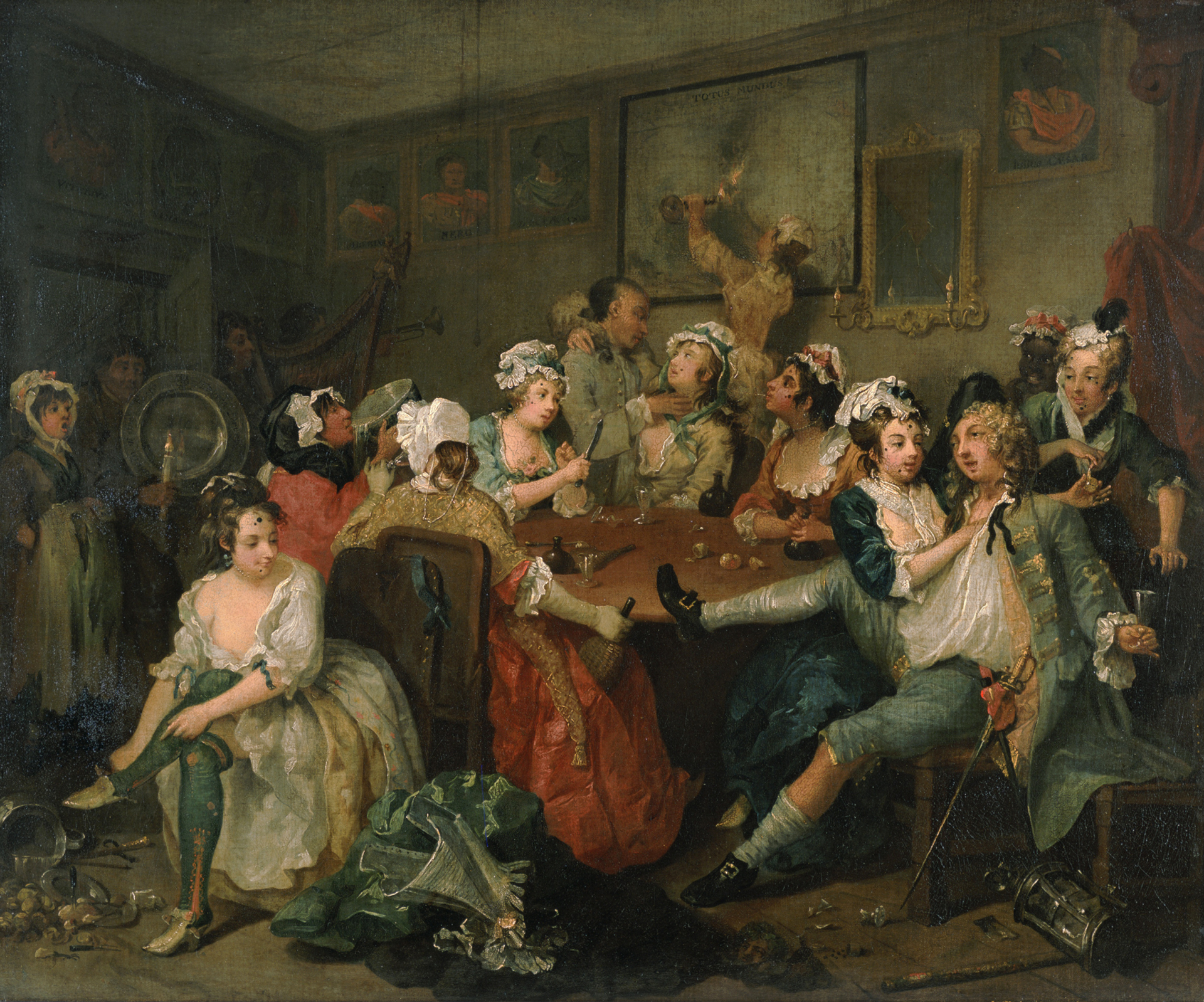 An image of scene three of Hogarth's Rake's Progress, which depicts a riotous scene on the combined brothel and the restaurant Rose Tavern. The protagonist Tom is shown drunk with his sword at his side and surrounded by prostitutes, is sprawling in a chair, with one foot on a table. Beside him is a rod and lantern, which he stole during his nocturnal wanderings in the streets. Two of the women are stealing Tom's watch. In the doorway a female street singer makes an appearance.