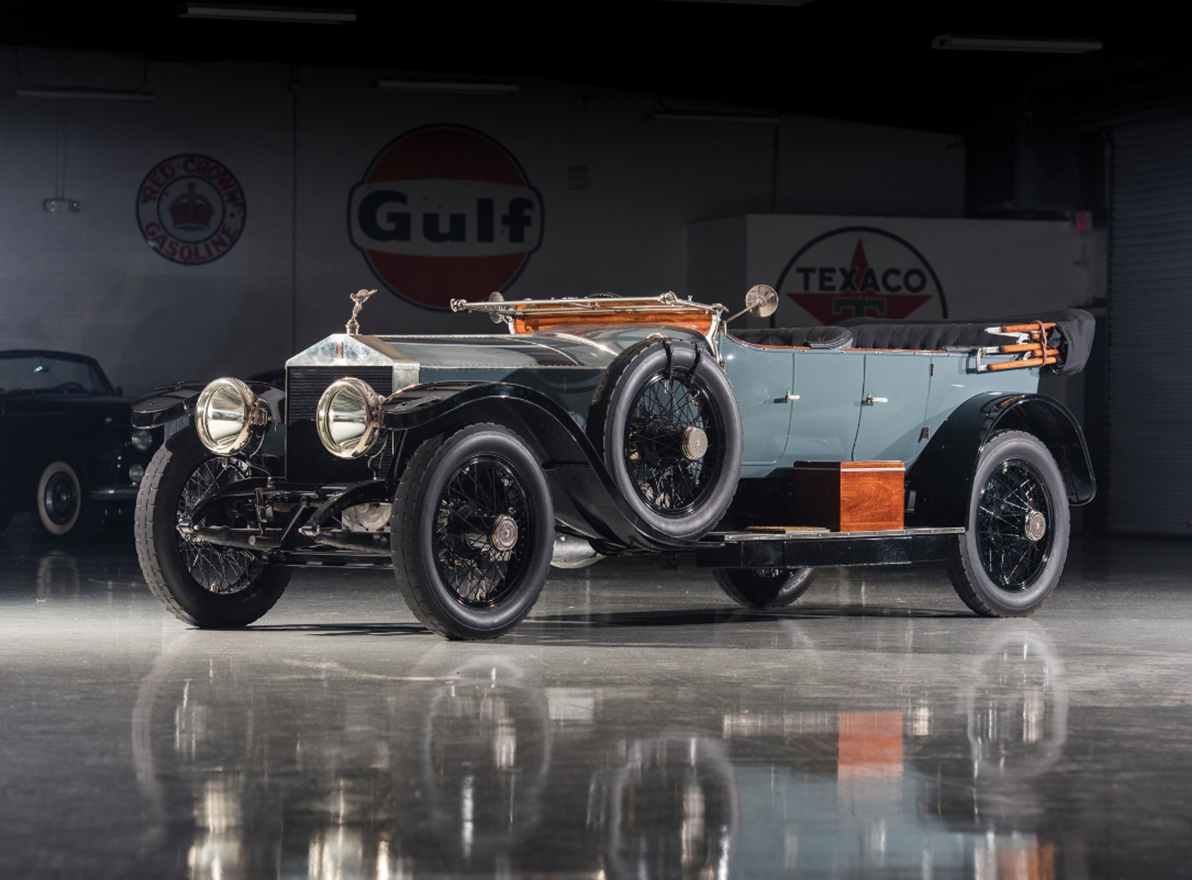 A 1914 Rolls-Royce Silver Ghost pictured in a car showroom.