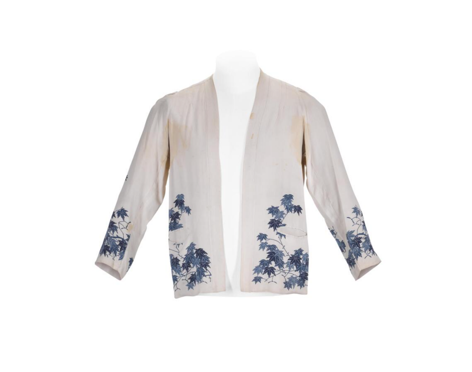 An image of a white kimono-style jacket, with blue detailing, owned by Freddie Mercury.