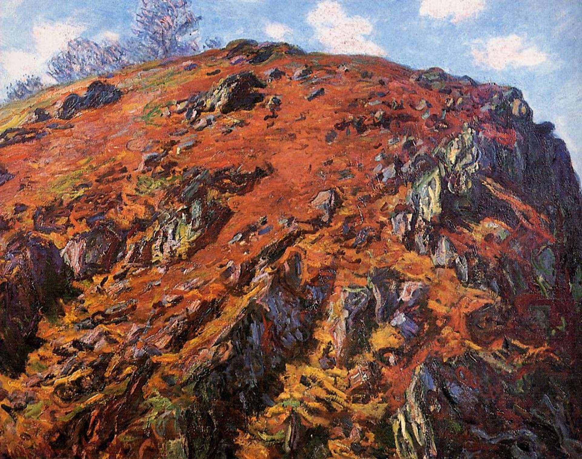 An image of the artwork Study of Rocks; Creuse: 'Le Bloc' by Claude Monet. It shows a large rock formation, highlighted in rich tones of orange, yellow and purple. It stands against a blue sky.