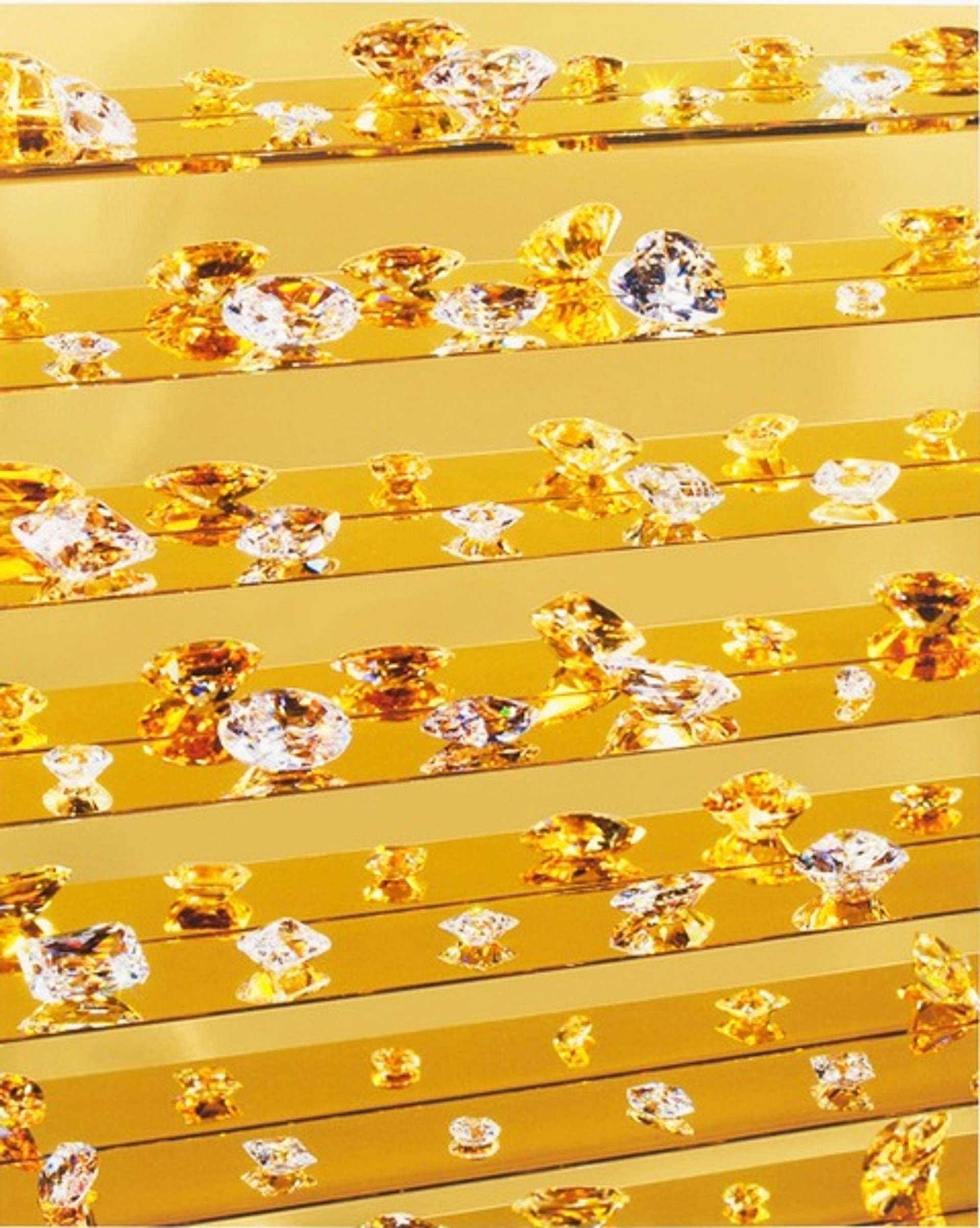 A series of gold shelves against a mirrored background. Diamonds, in varying shapes and sizes, line the shelves and reflect the golden light.