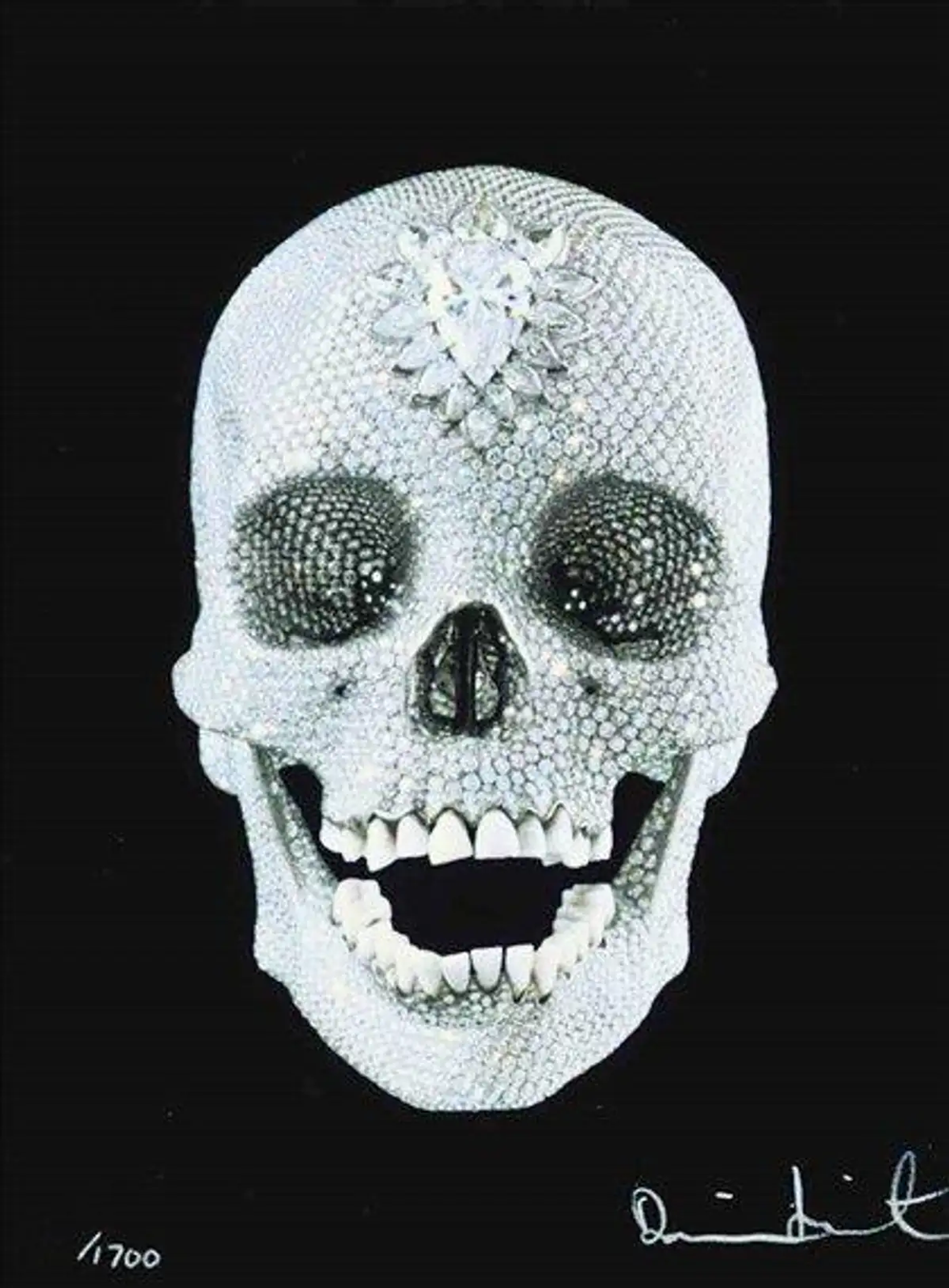 An image of a print by Damien Hirst, showing his infamous diamond-encrusted skull against a black background.
