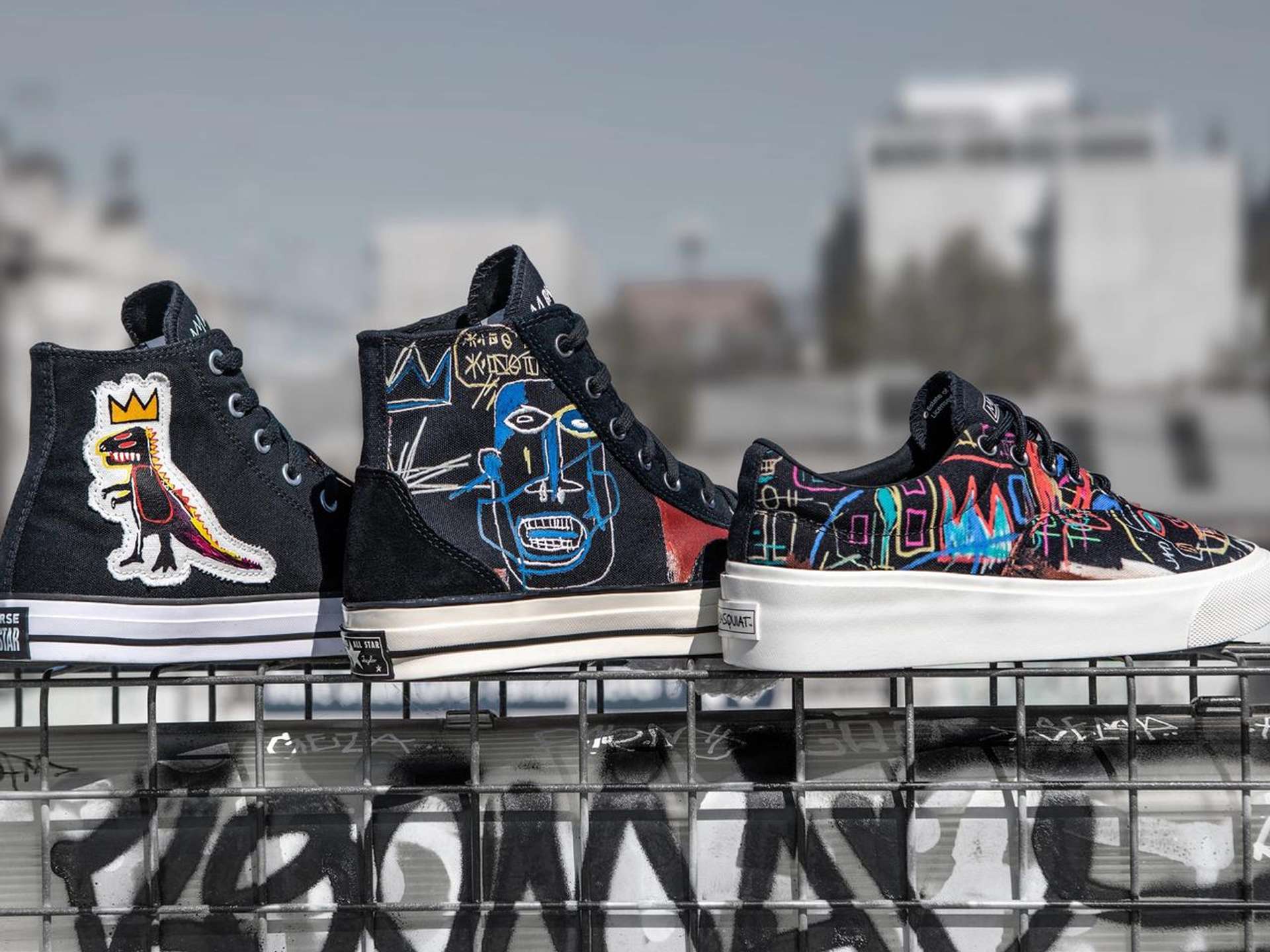 An image of three models of sneakers from the collaboration between Converse and Basquiat.