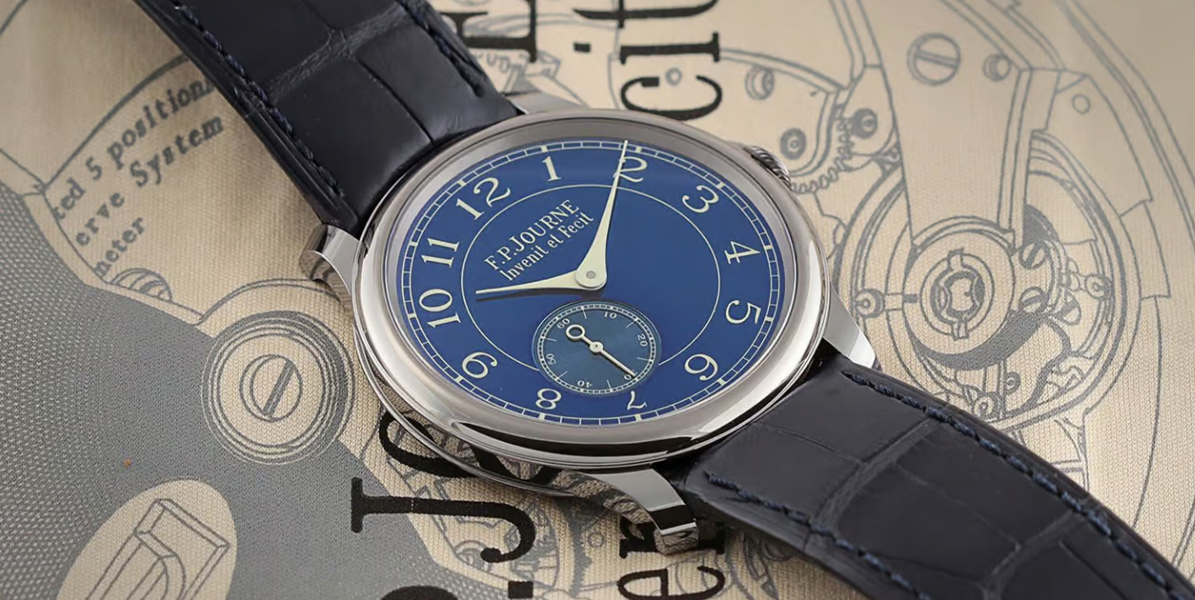 A 2009 F. P. Journe, the Chronometre Bleu against a printed fabric background.