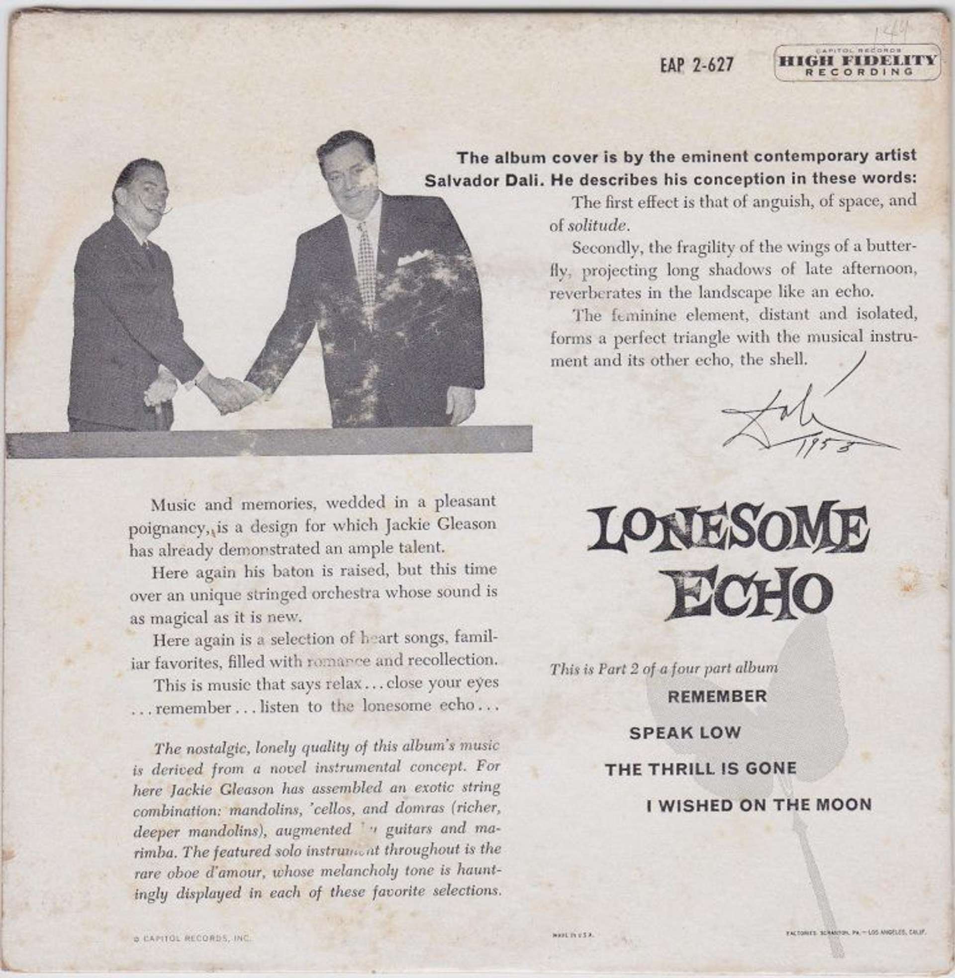  An image of the back cover of the album Lonesome Echo by Jackie Gleason, showing the singer shaking hands with artist Salvador Dalí