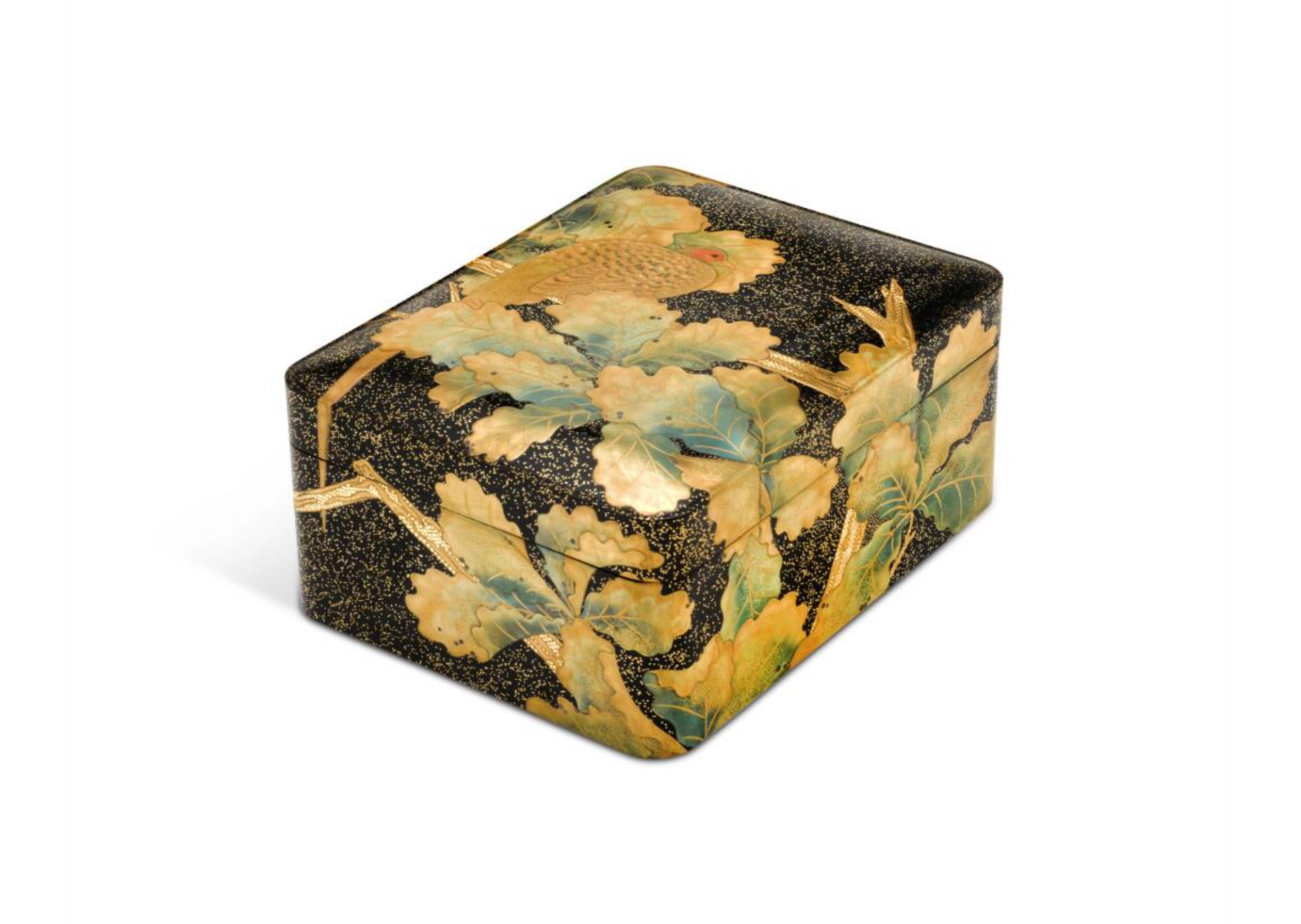A rounded rectangular box with close-fitting cover, decorated in gold, silver, red and green. Inlays of gold foil on a black lacquer ground with hirame, with a pheasant in the branches of an oak tree.
