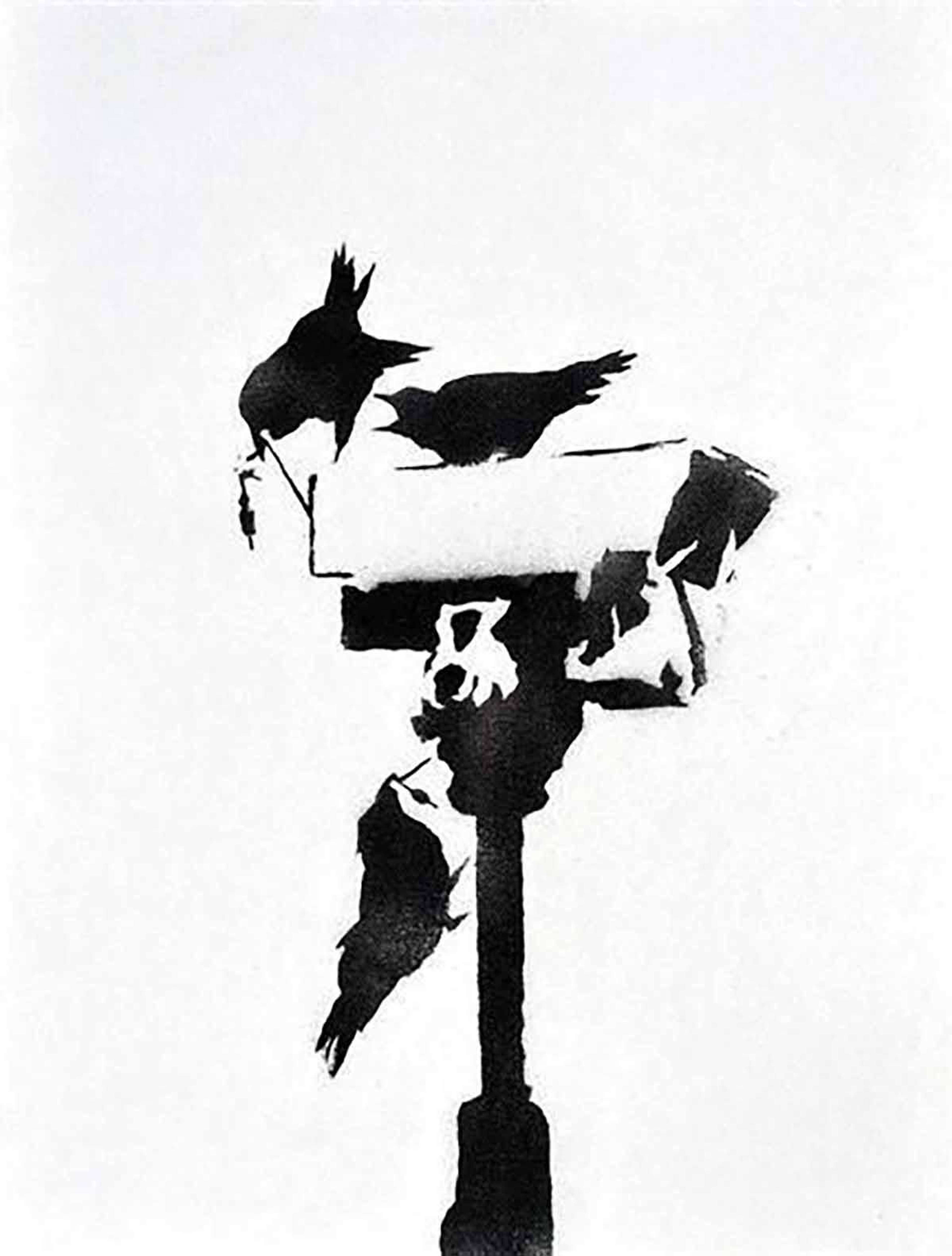 Banksy’s Angry Crows. A spray painted work of a surveillance cameras with black crows on it. 