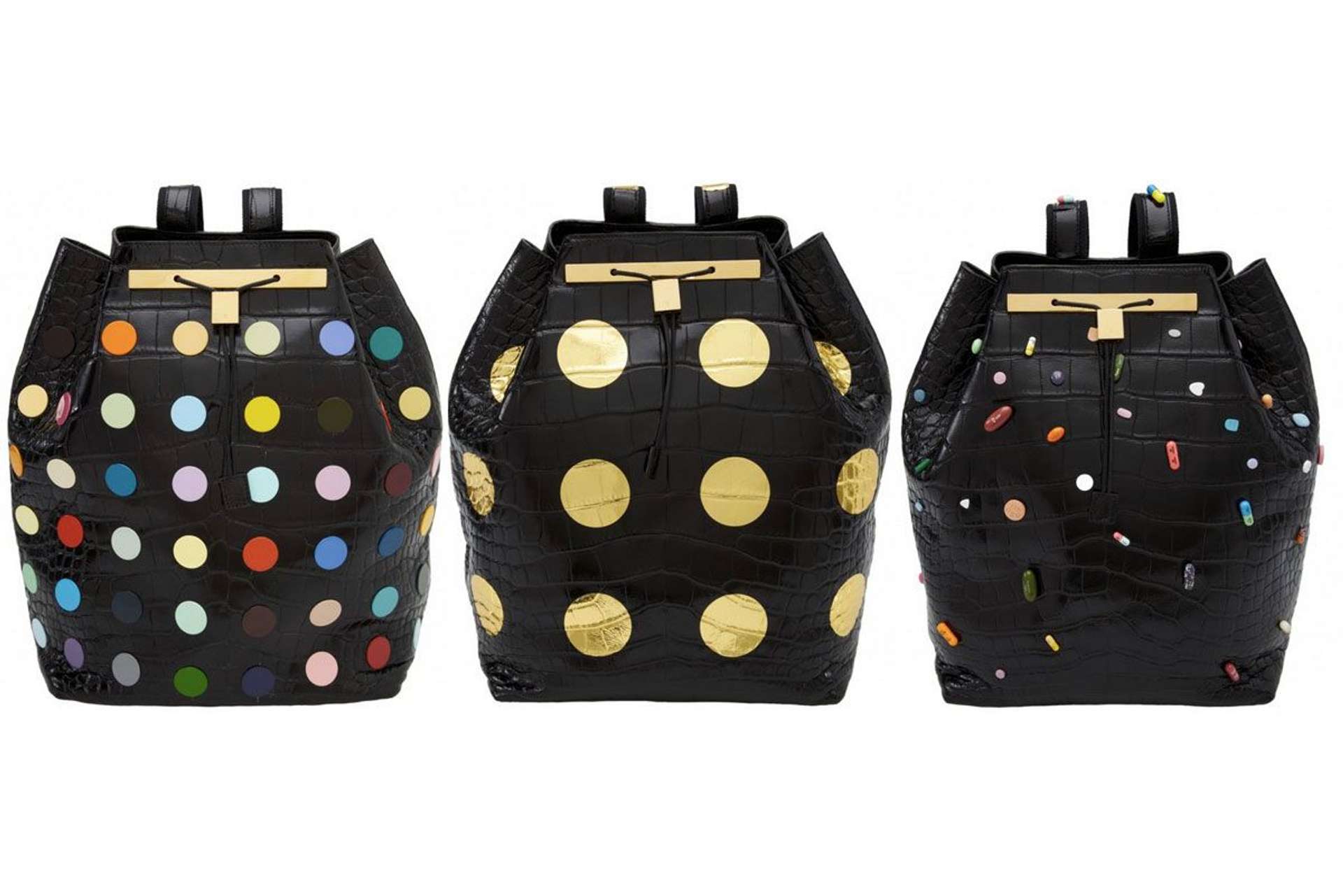 An image of three black backpacks in different designs by Damien Hirst for fashion house The Row.