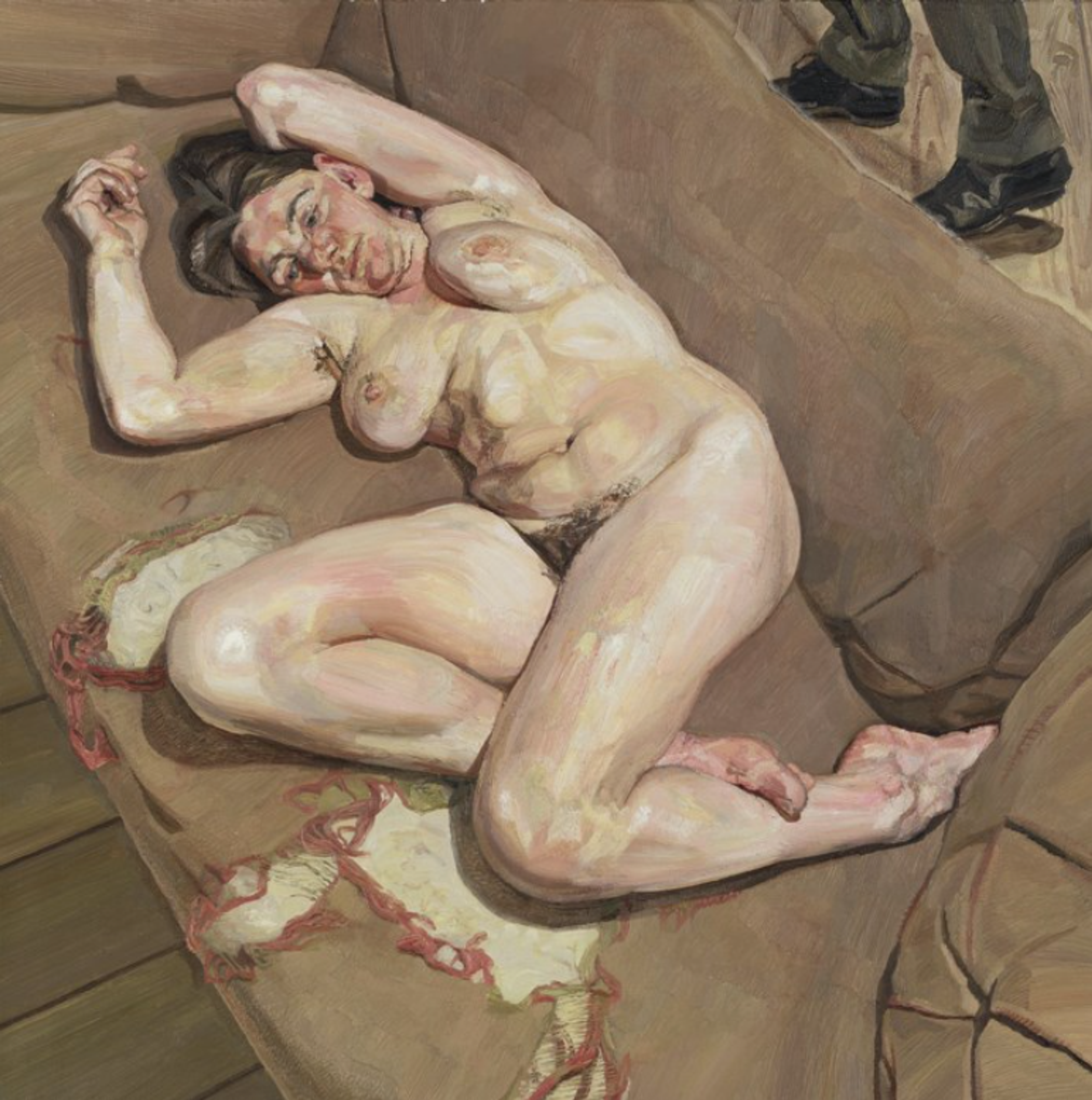 Nude woman reclining on a sofa 