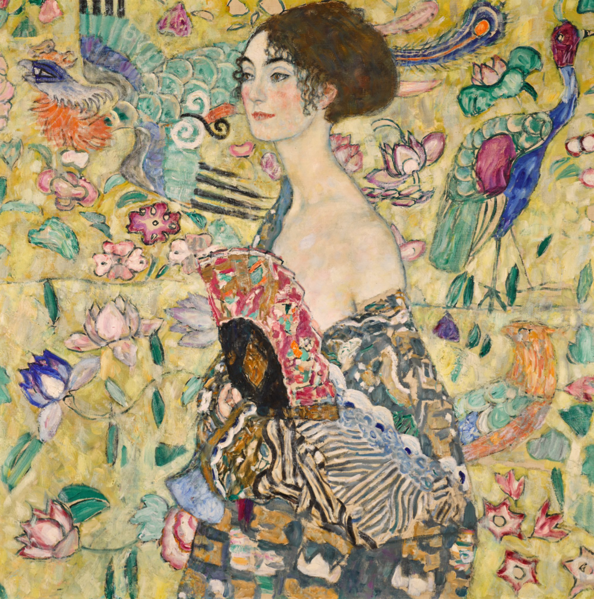 A colourful oil on canvas work by Gustav Klimt depicting a lady with a fan, set against a tapestry of flowers and birds.