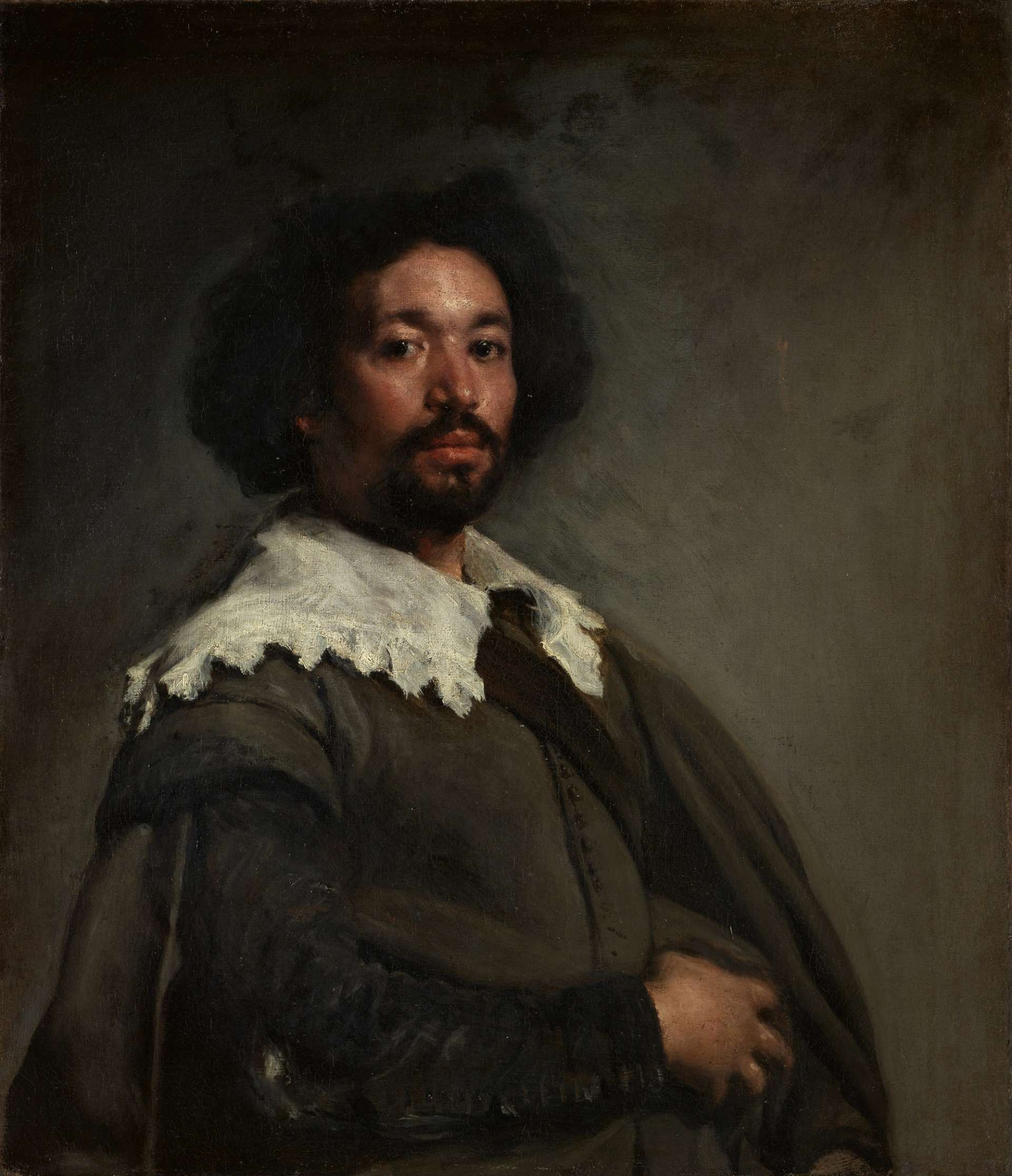 A portrait of a gentlemen wearing period dress against a dark washed background.