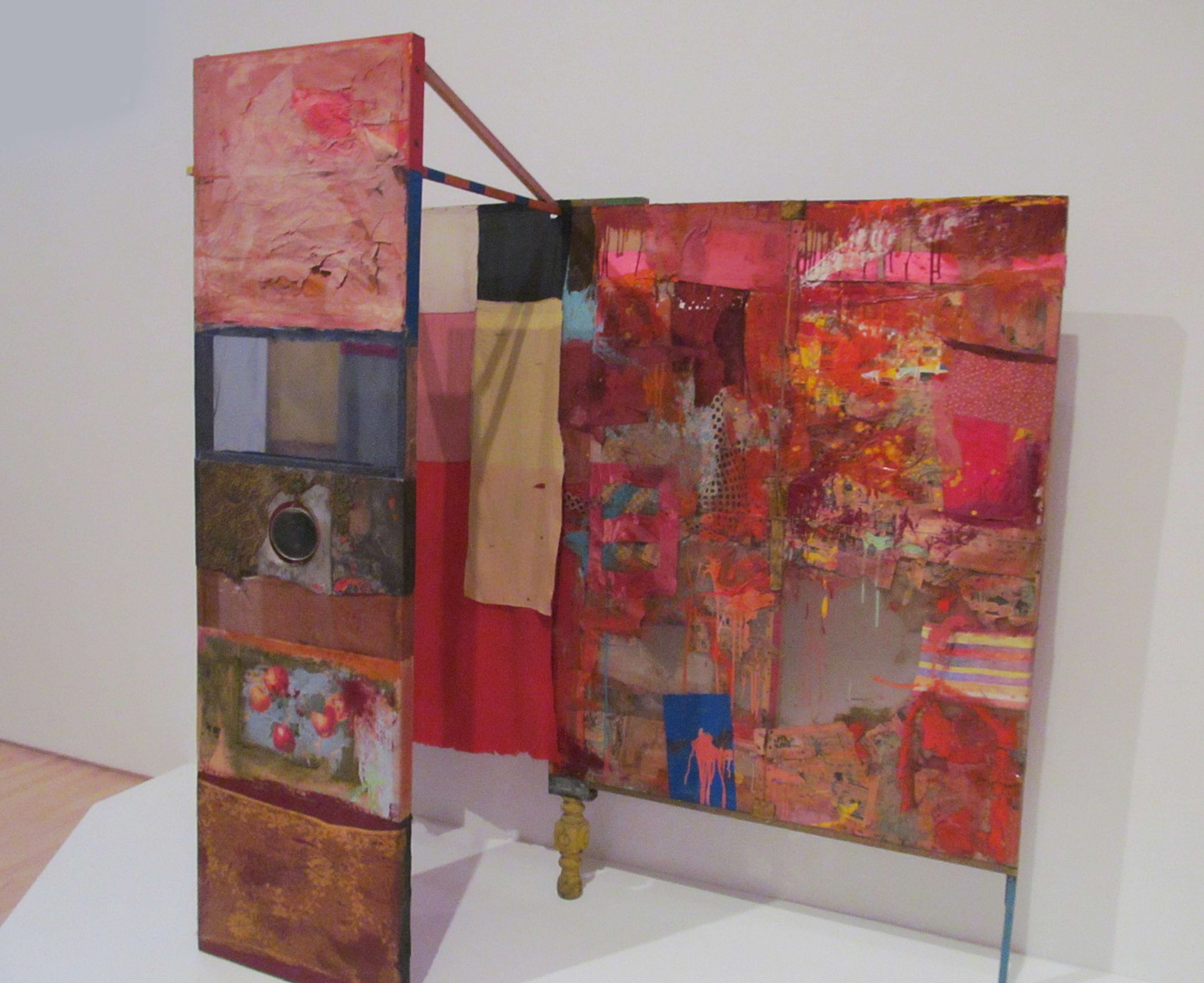 A collage structure combining different textiles and mediums